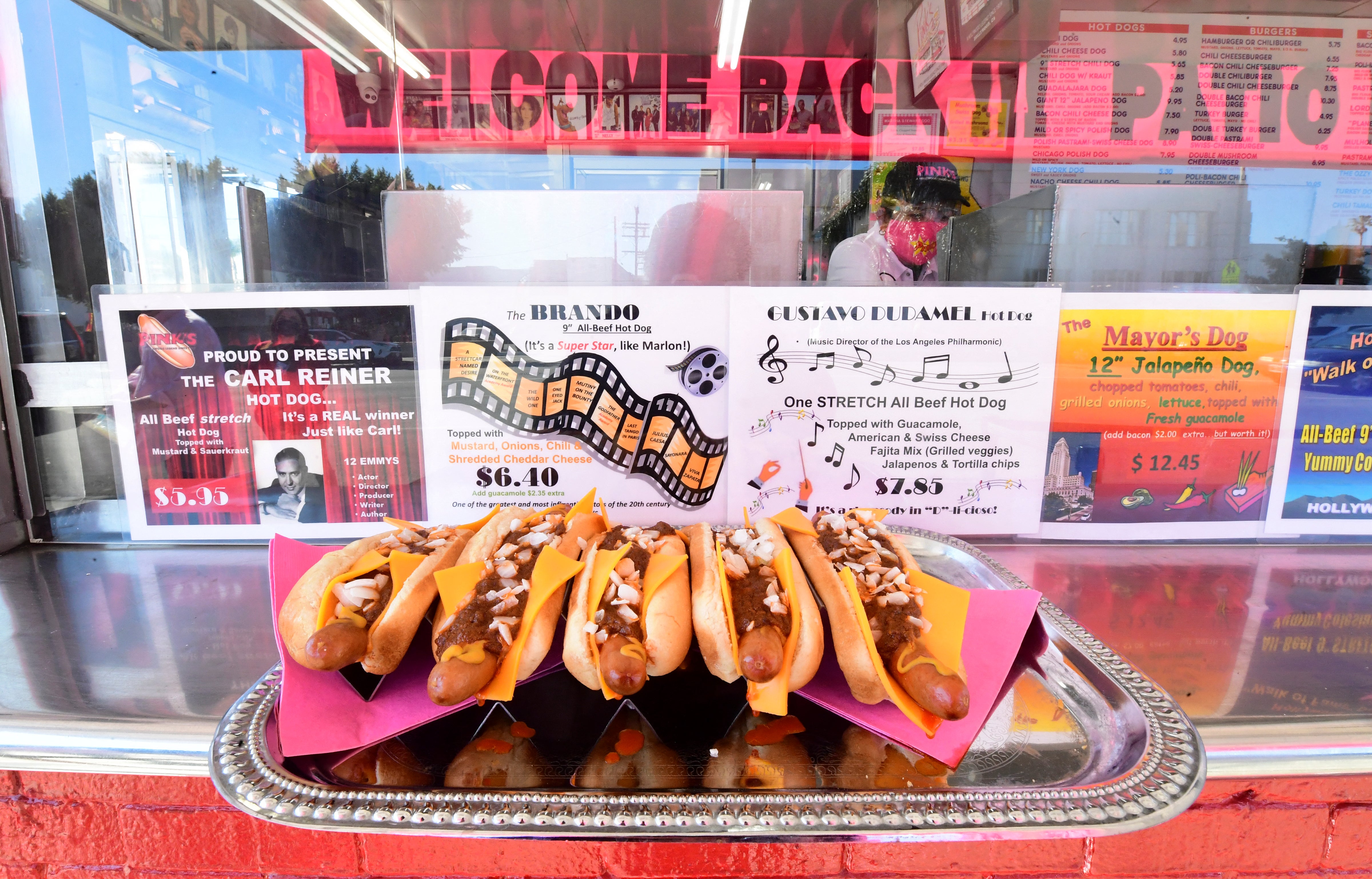 Pink's is known for oversized hot dogs featuring toppings including chili, cheese, bacon, jalapeños and onion rings