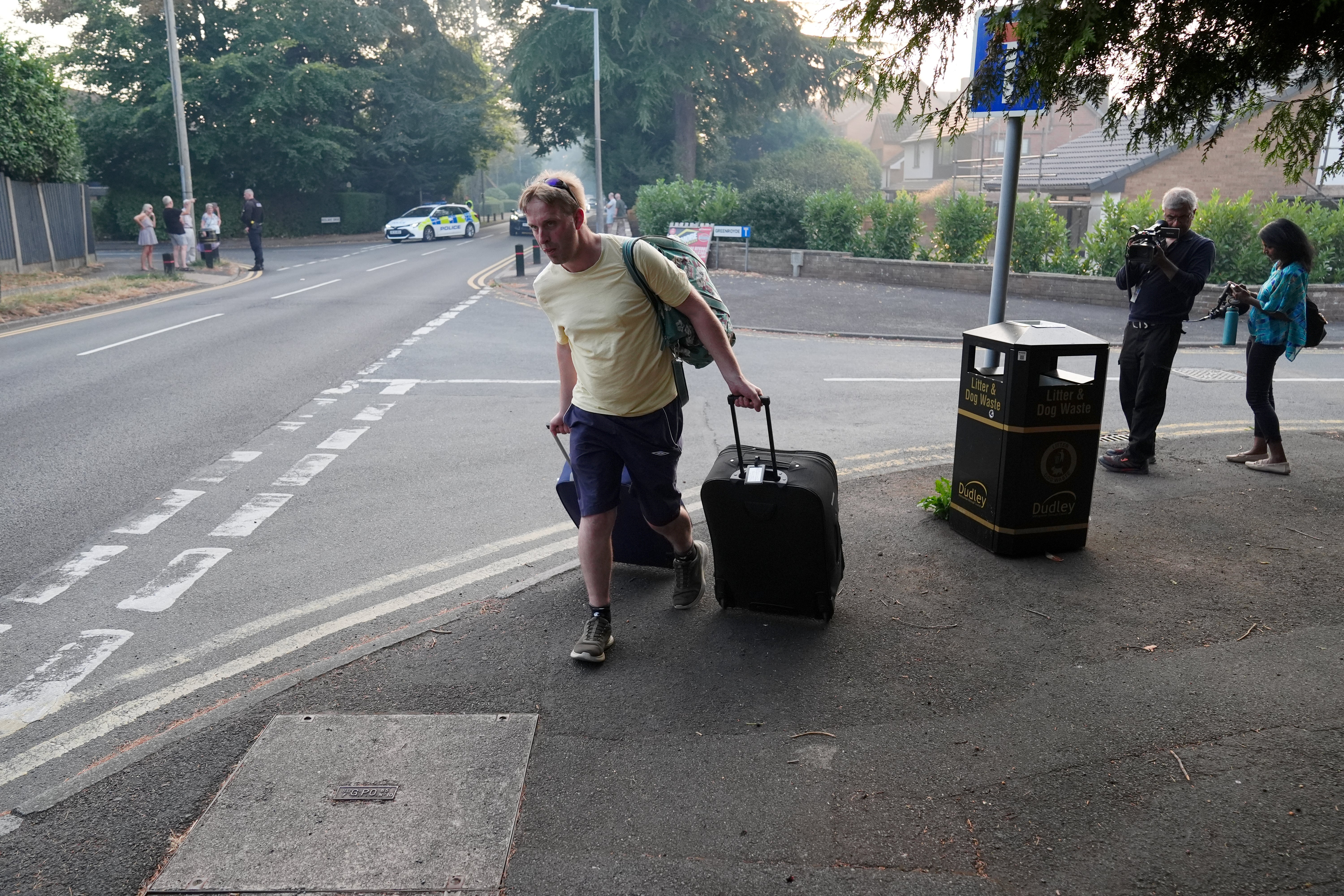 A resident leaves their home after a fire broke out in the Stourbridge area
