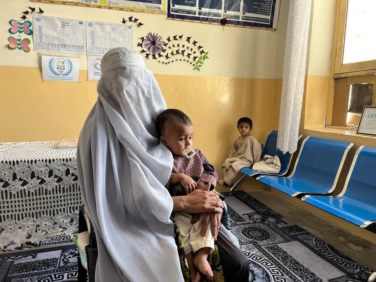 Farida, 20, at a WFP clinic in Kandahar with her six-year-old son