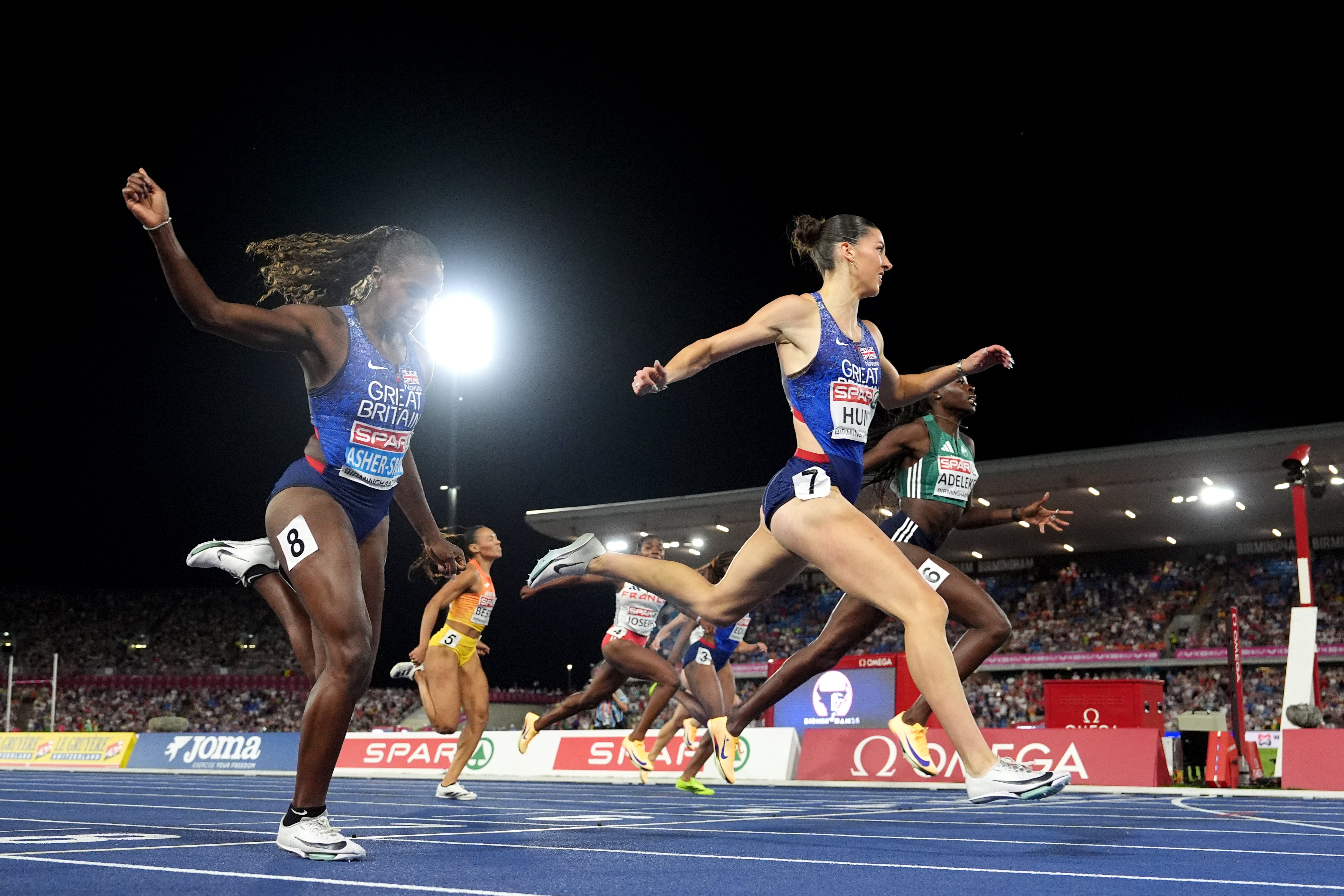 Amy Hunt crosses the line in first place ahead of Ireland’s Rhasidat Adeleke, right, in second and Dina Asher-Smith in third (Martin Rickett/PA)