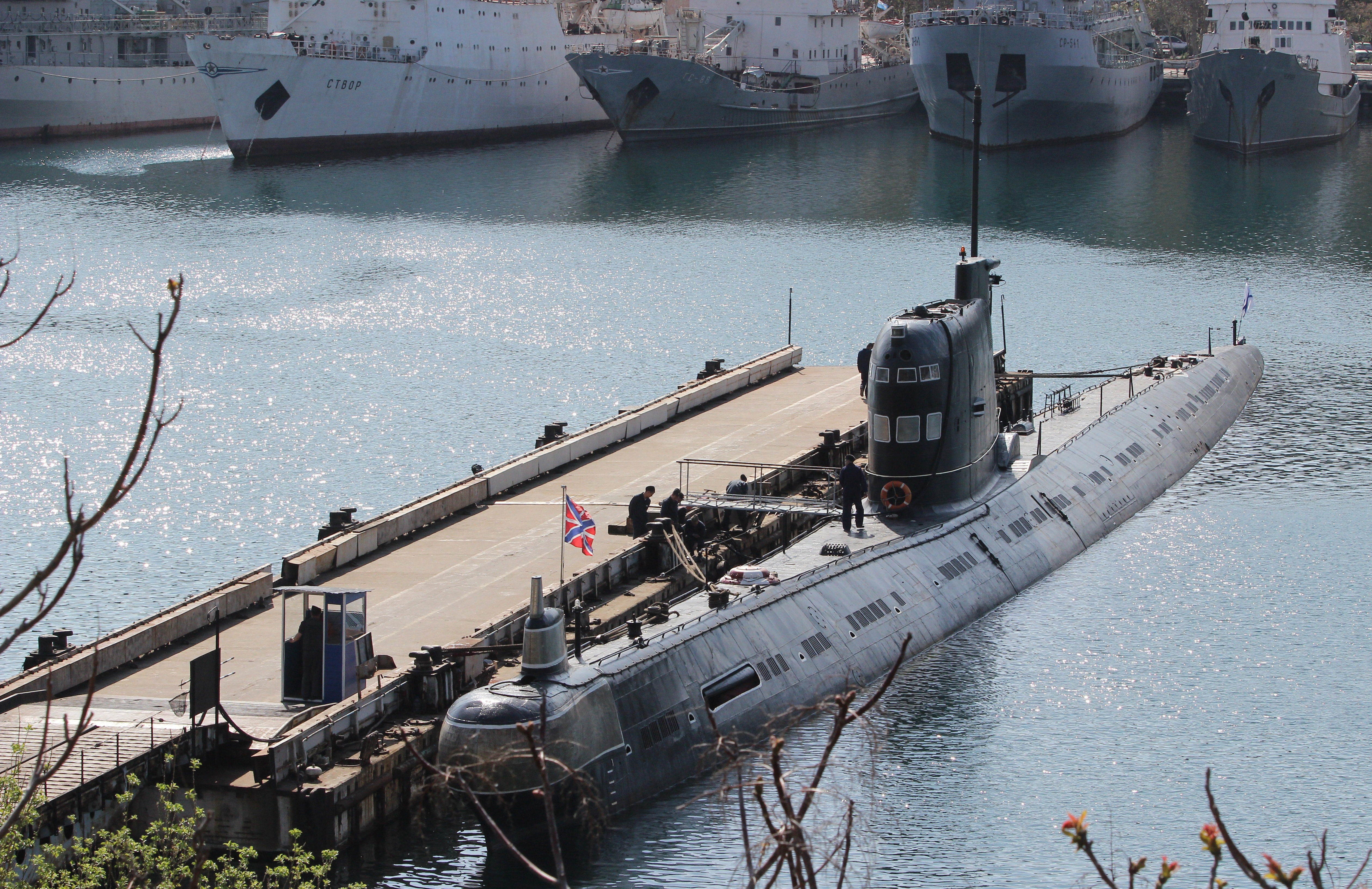 Russian naval flags are seen on the Zaporizhzhia' former Ukrainian submarine moored in the bay of the Crimean port of Sevastopol on April 17, 2014. Ukraine's maritime forces have been severely diminished by the Russian intervention in Crimea after they lost 12 of their 17 warships to Moscow