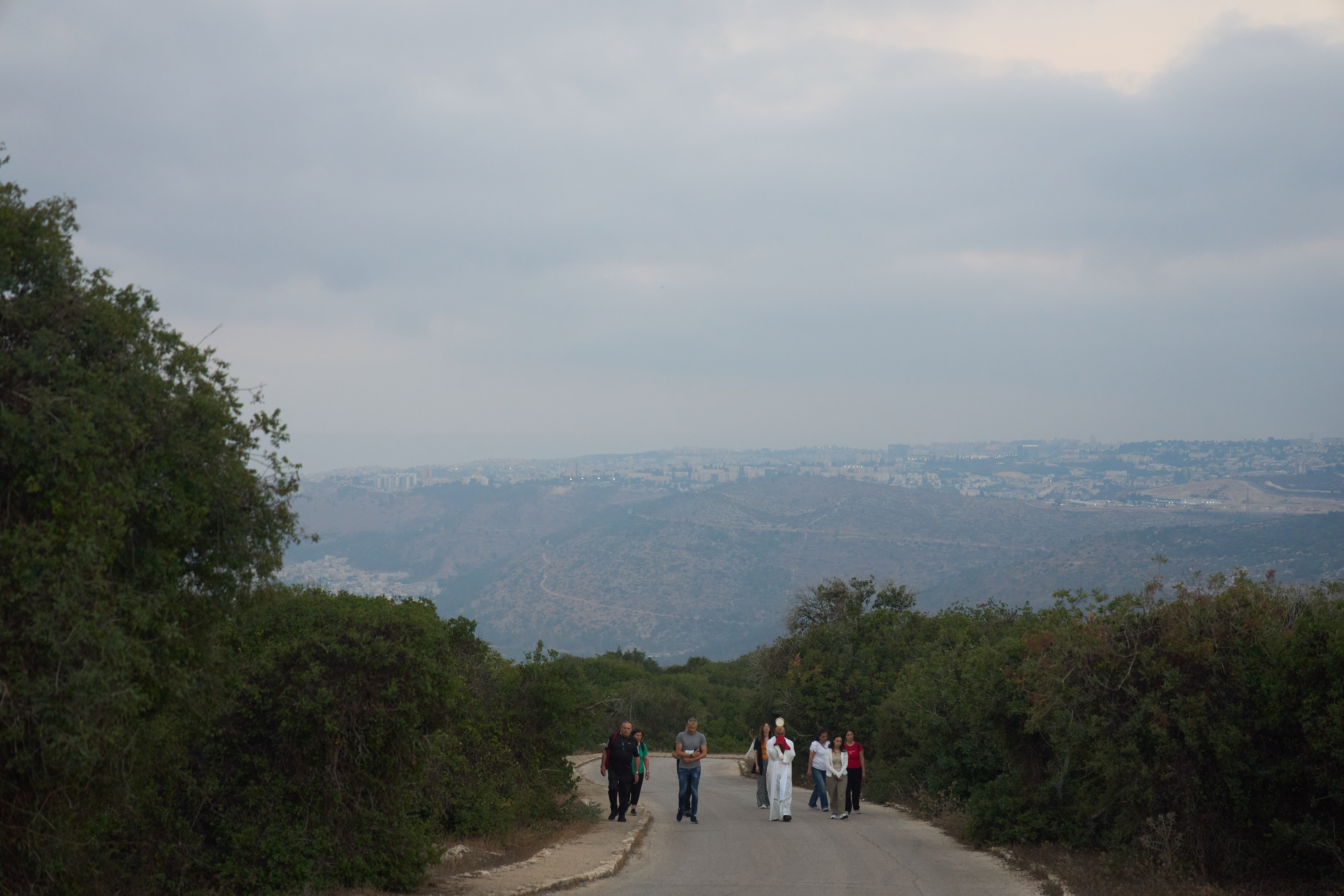 Rev. Fadi Shallufi leads Catholic pilgrims on a Eucharistic procession climbing to the Basilica of the Transfiguration on Mount Tabor, northern Israel, on Aug. 6, 2026. (AP Photo/Ariel Schalit) (Copyright 2026 The Associated Press. All rights reserved)
