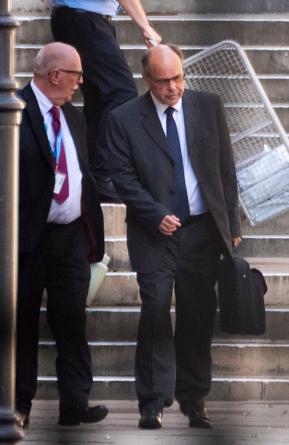 Glyn Razzell (right) leaving the Royal Courts of Justice, central London, where the High Court is hearing the Ministry of Justice's challenge to the Parole Board decision to release him (PA)