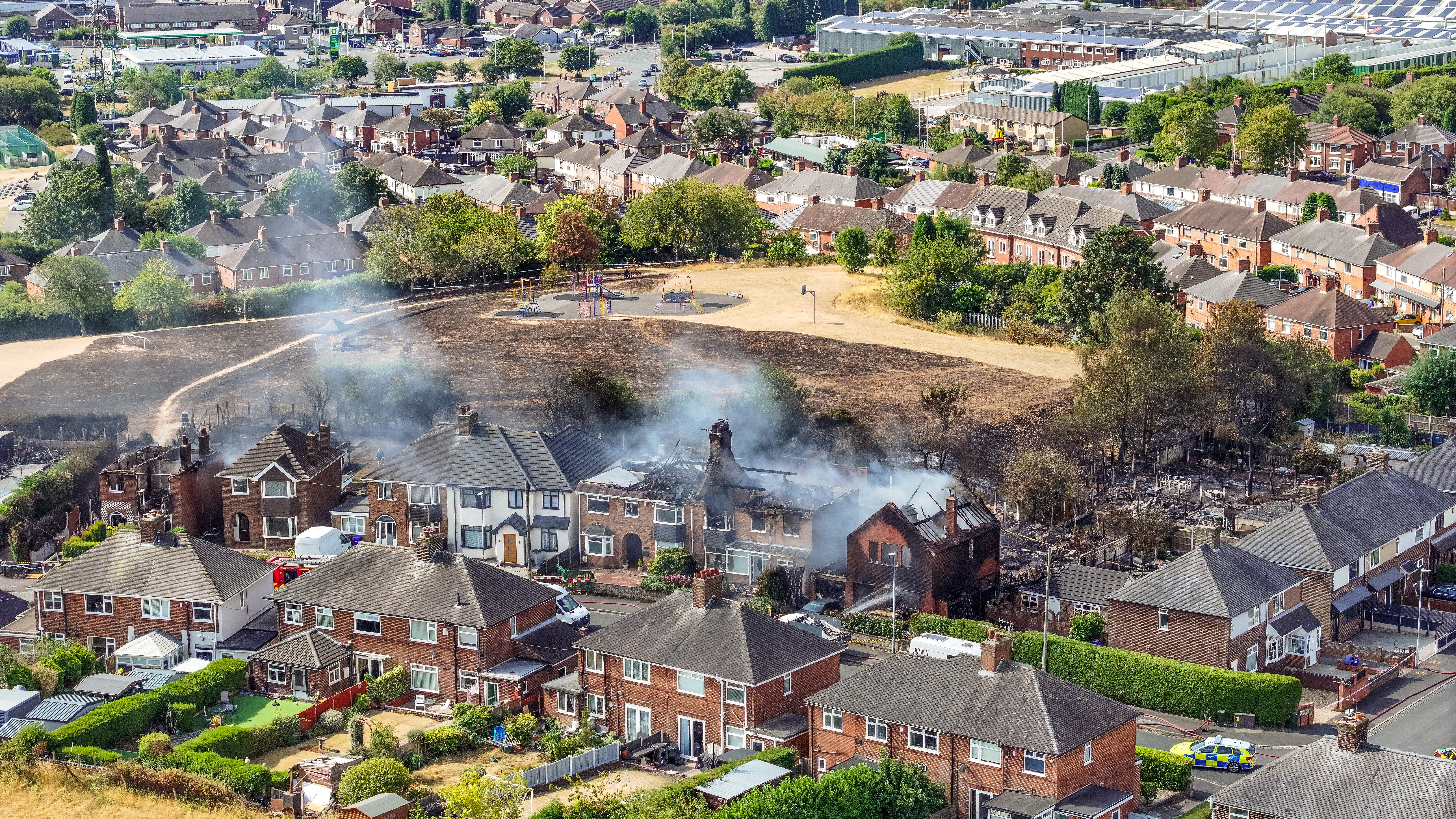 Man and woman arrested over grass fire that damaged four houses
