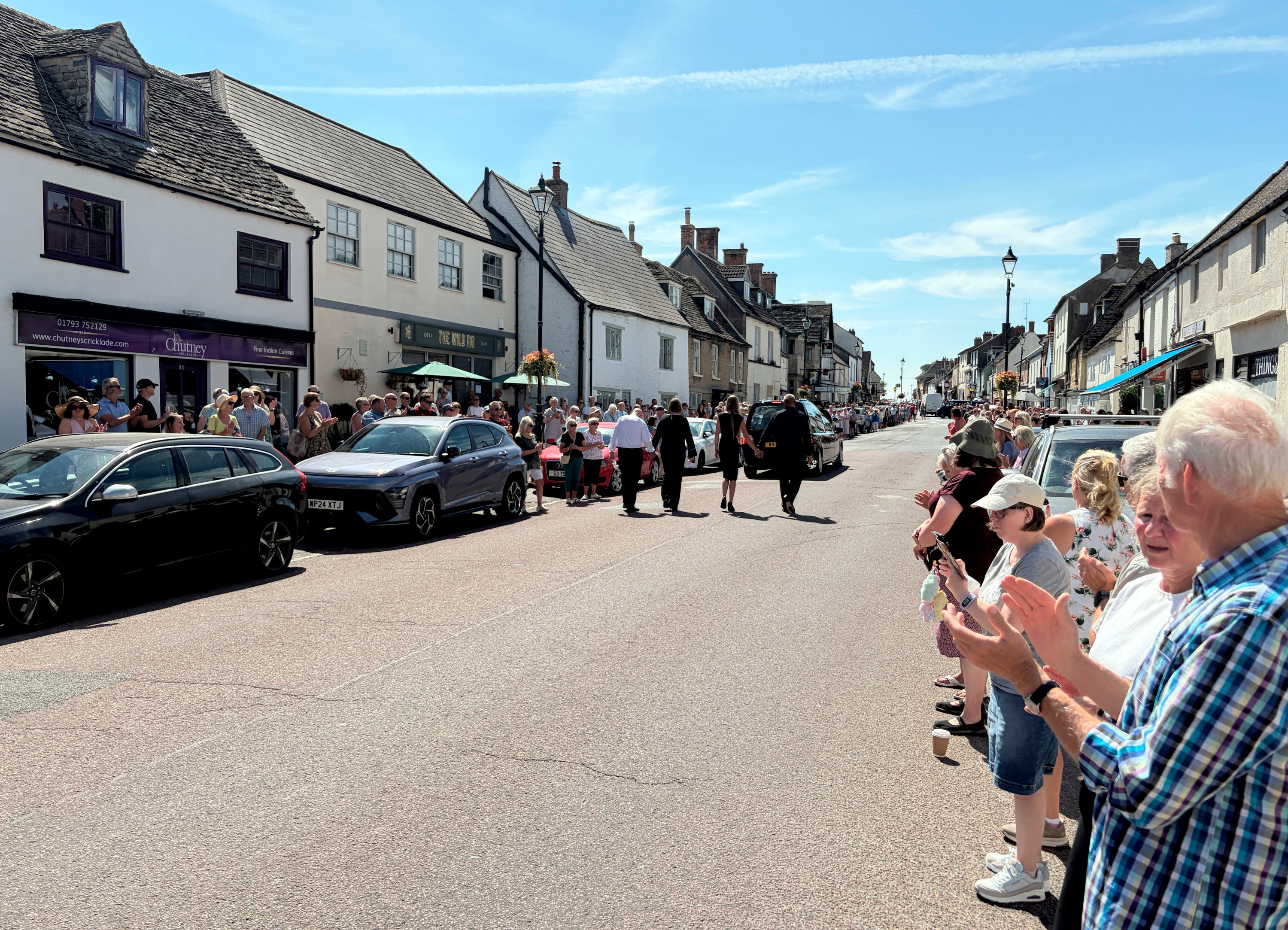 The cortege paused briefly outside the Animal Fayre shop before continuing its journey to the North Wiltshire Crematorium