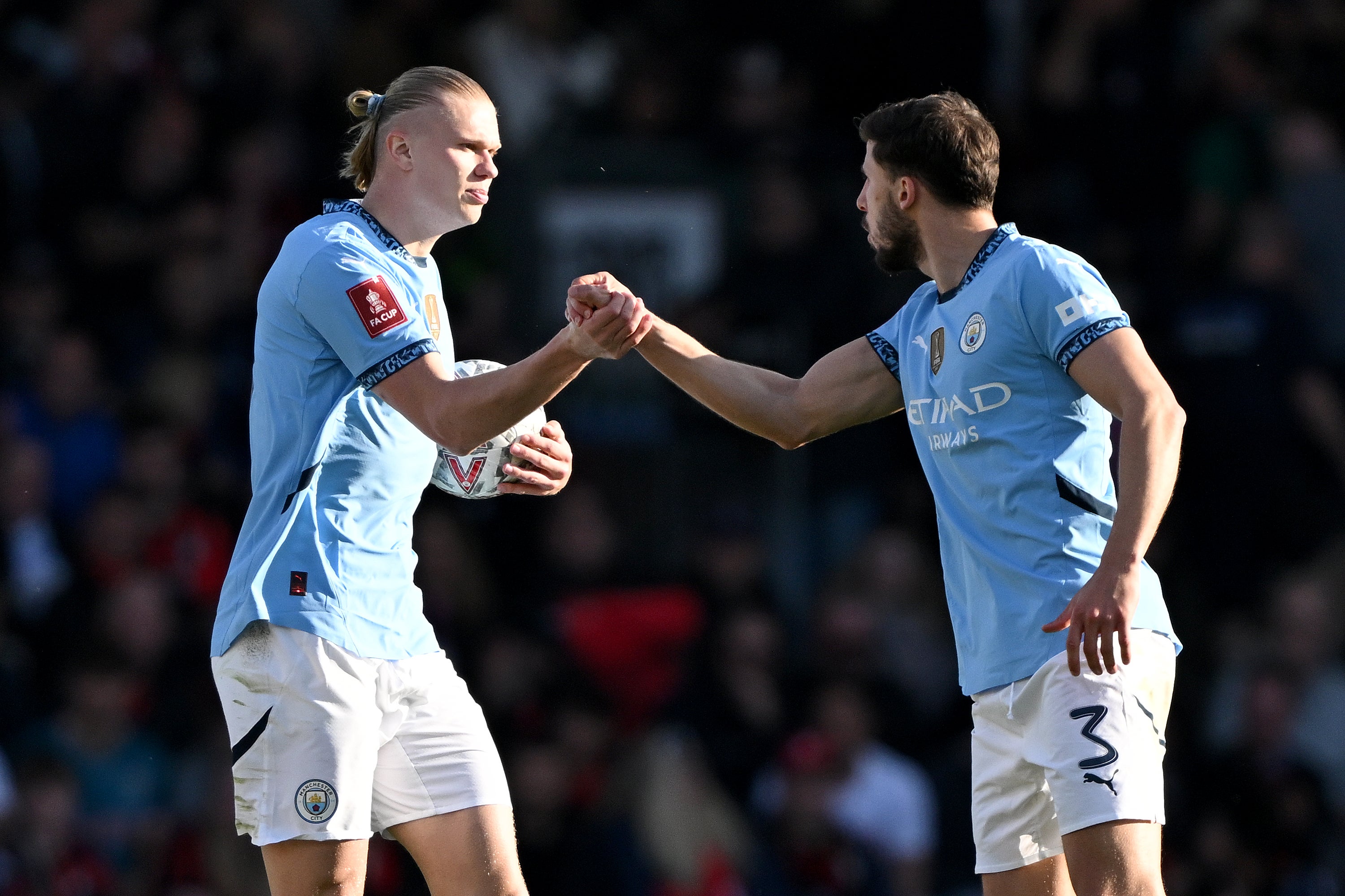 Ruben Dias (right) appears likely to be appointed Manchester City captain