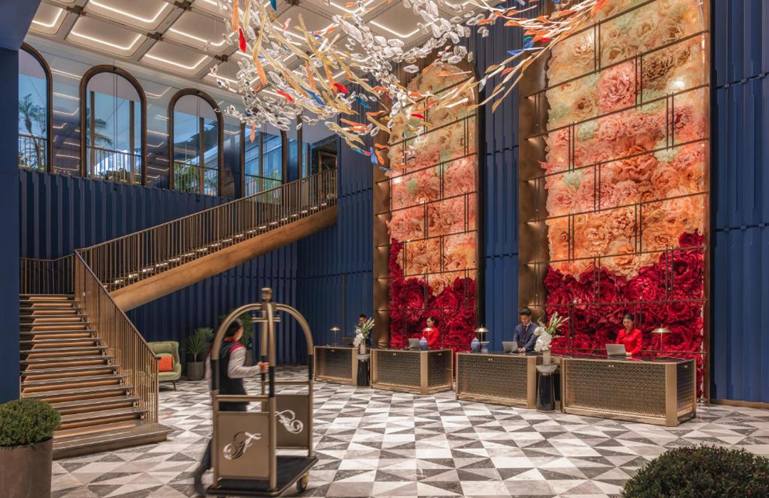 The lobby features a floral display that changes with the seasons