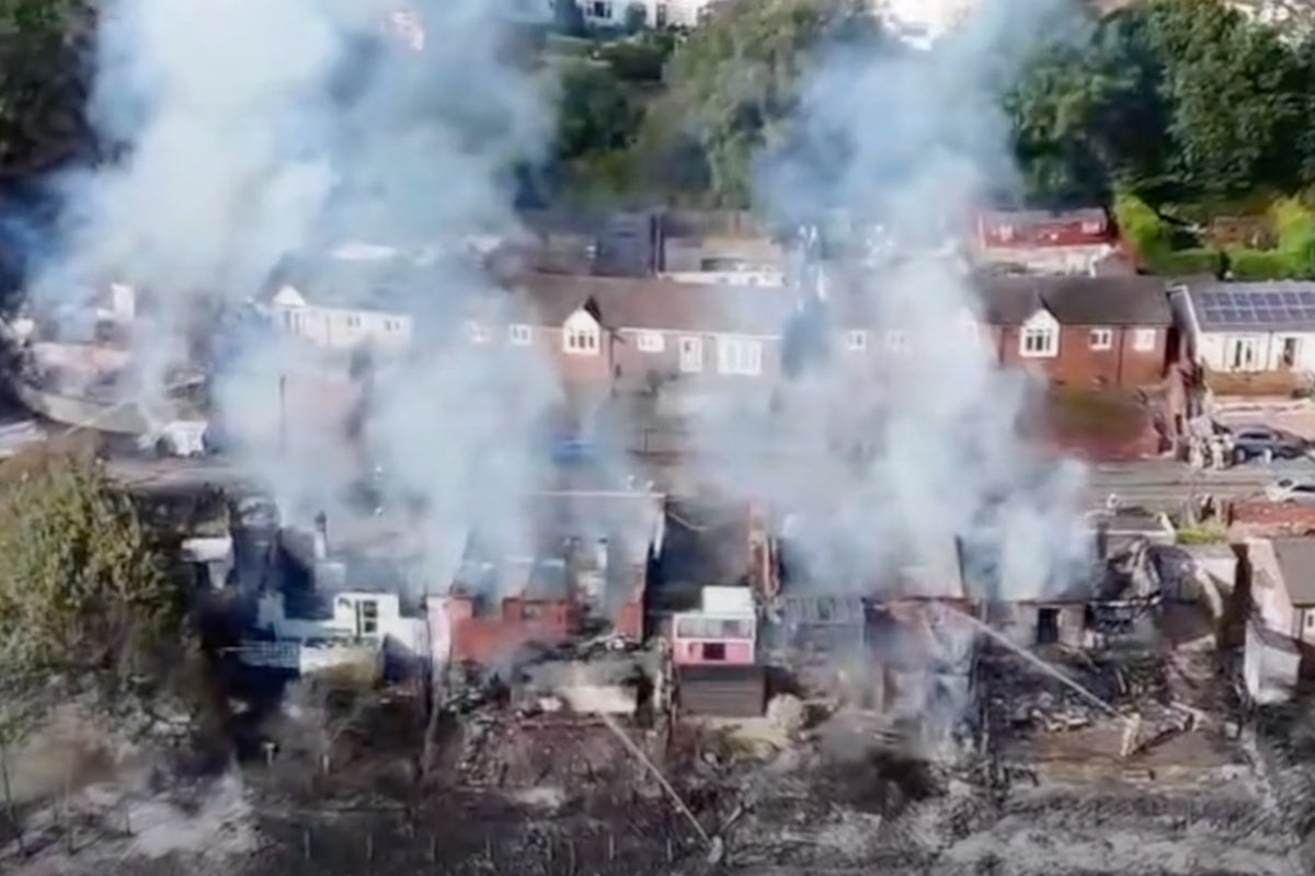 Woman arrested after suspected arson destroys five homes in Welsh town Woman arrested after suspected arson destroys five homes in Welsh town