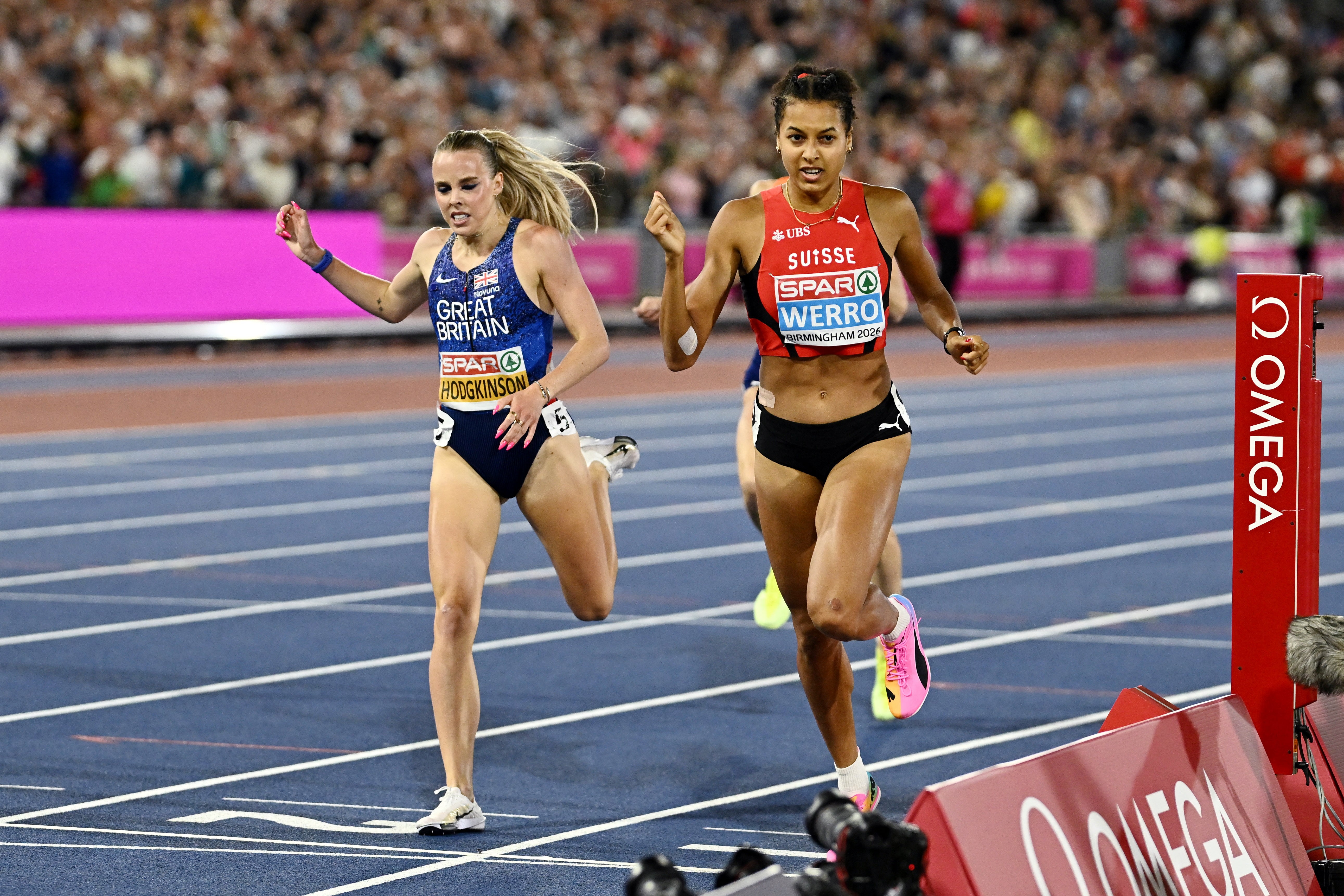 Gold medallist Switzerland's Audrey Werro crosses the finish line ahead of silver medallist Keely Hodgkinson