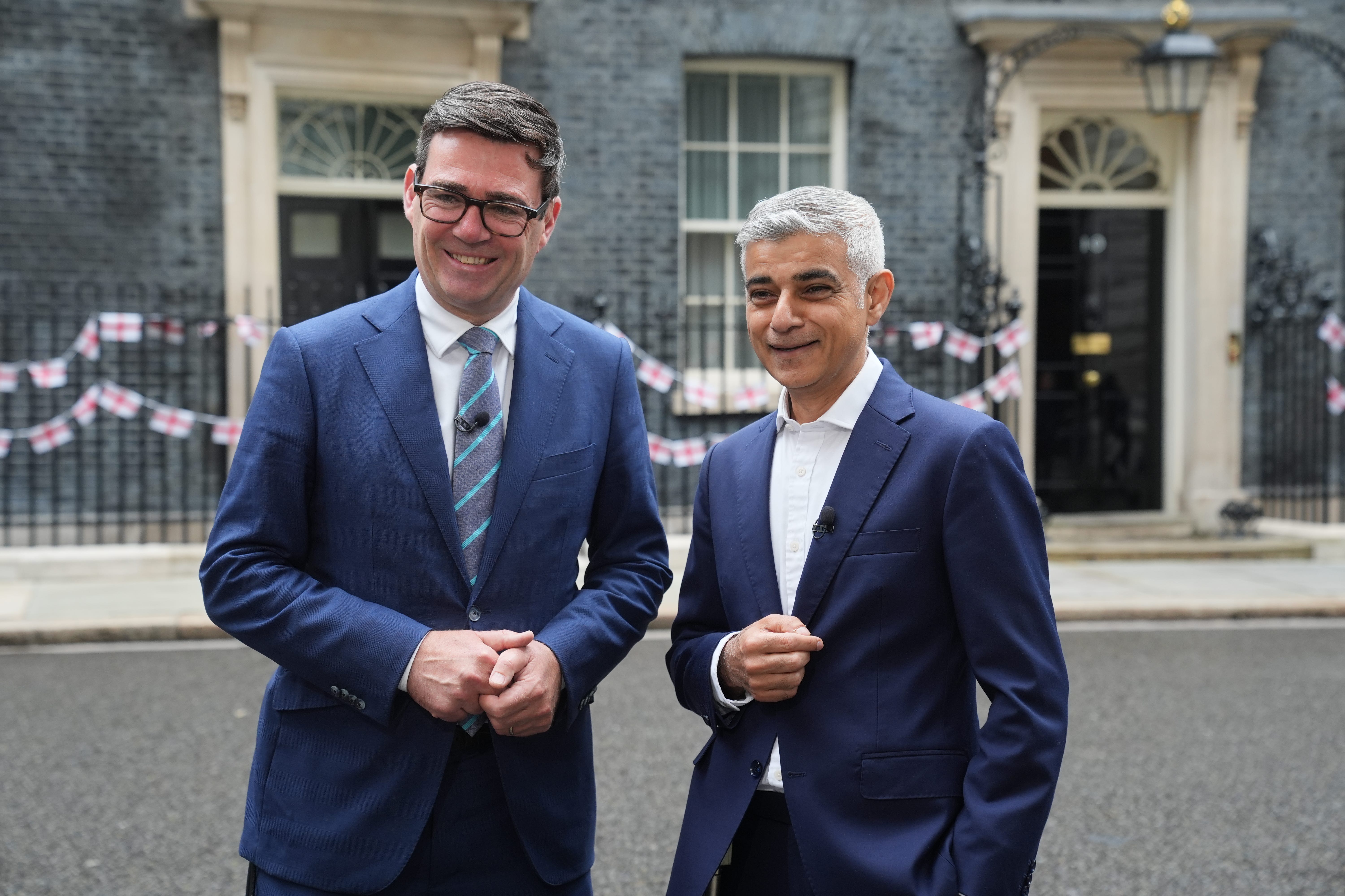 Sir Sadiq Khan has urged Andy Burnham not to slow down in the drive to net zero (PA) (PA Archive)