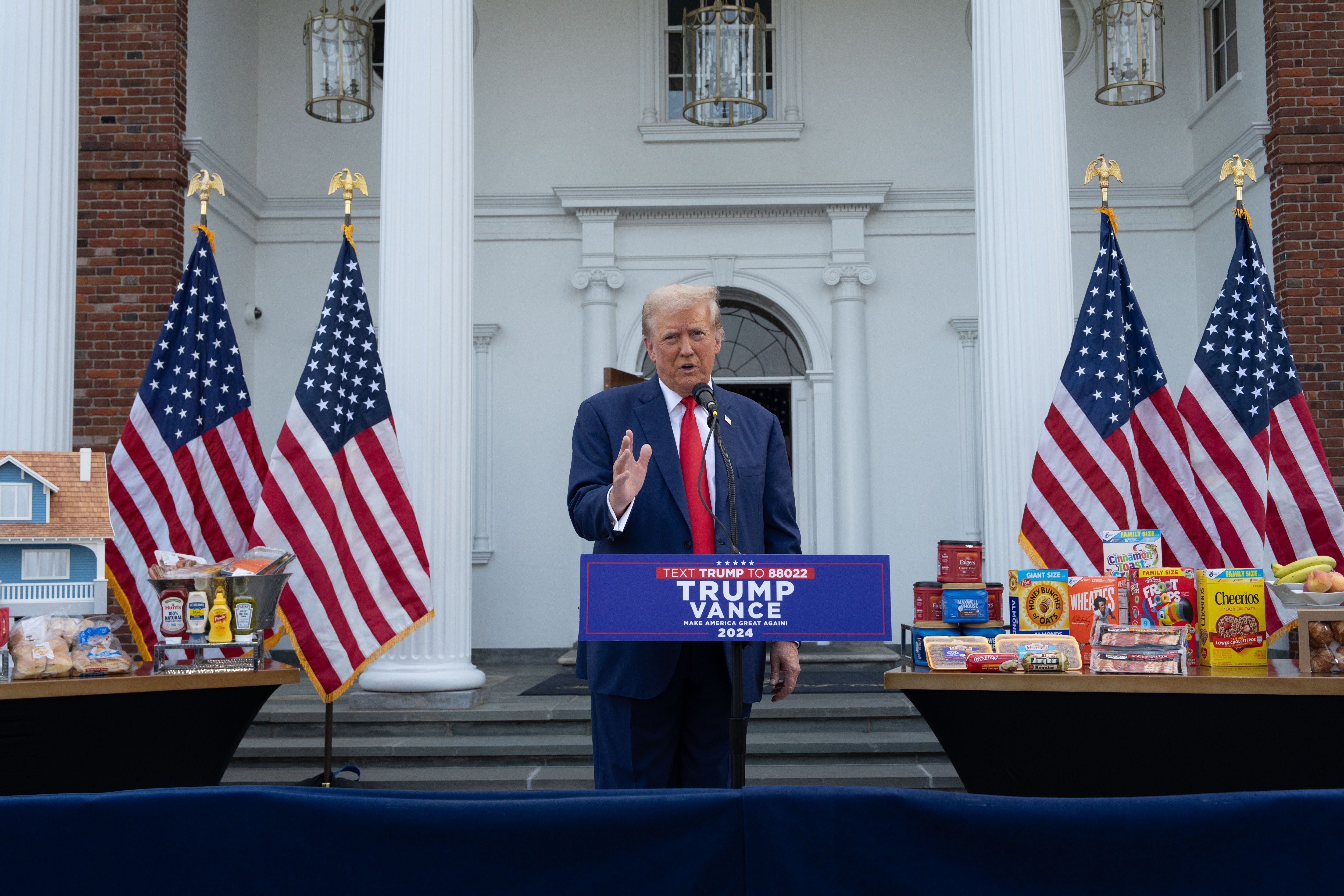 He stood amidst displays stacked with meat, fruit, cereal, milk and standard pantry items while laying the blame for steep grocery price hikes on the Biden administration