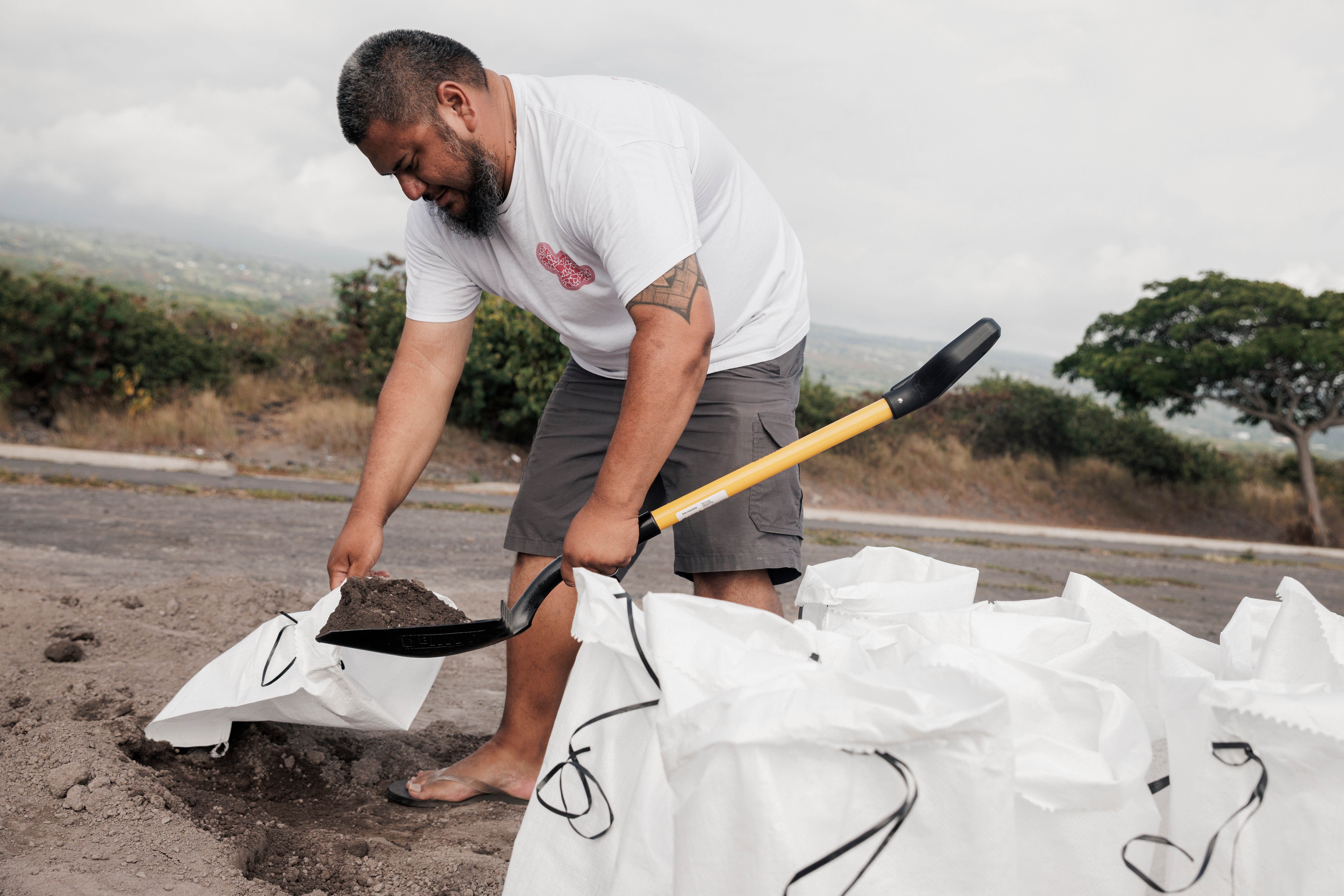 Residents pack sandbags in preparation for Tropical Storm Lala
