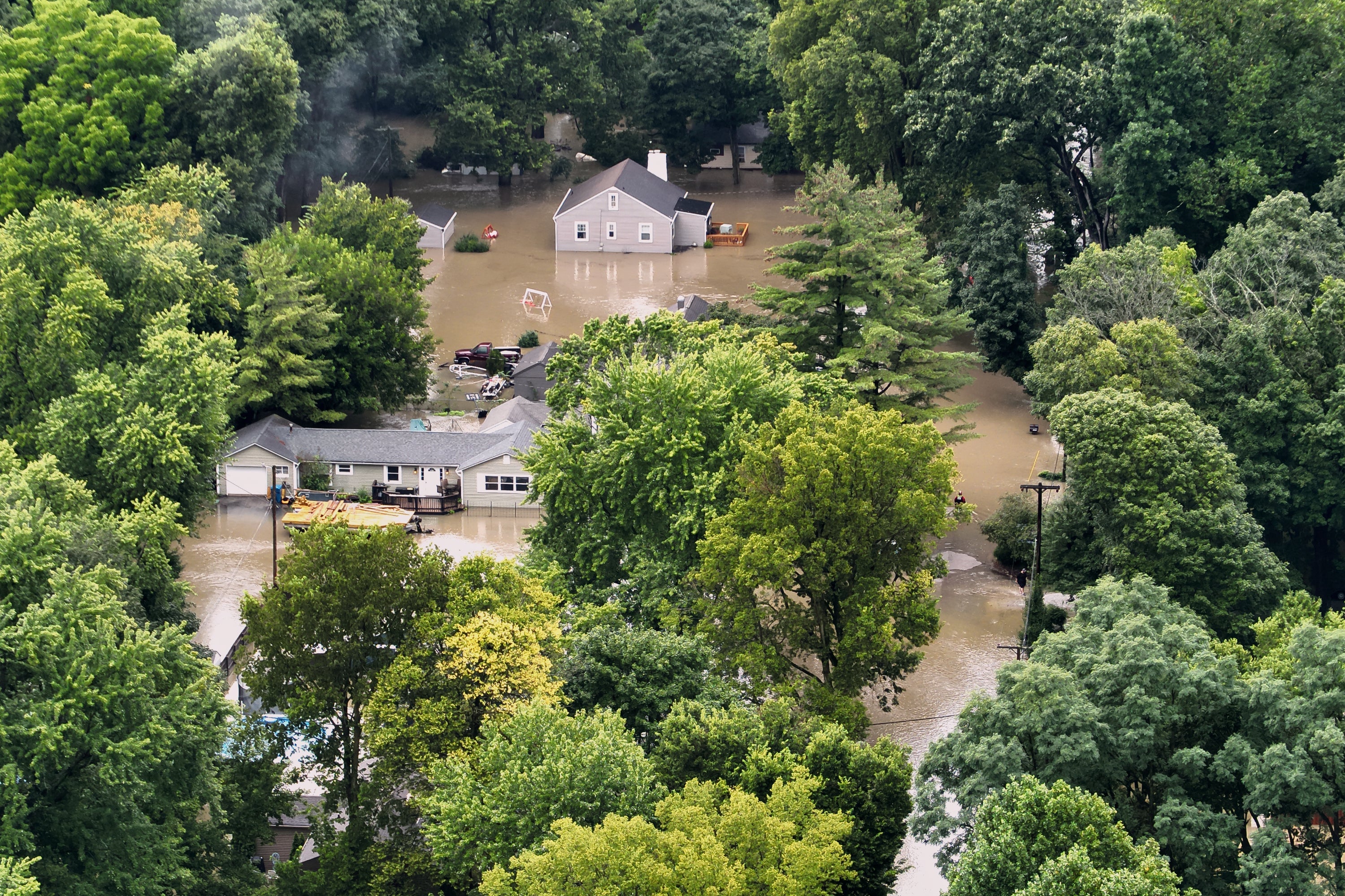 Five dead in Indiana as &lsquo;once-in-a-lifetime&rsquo; flooding swallows homes - and water &lsquo;is still rising&rsquo;