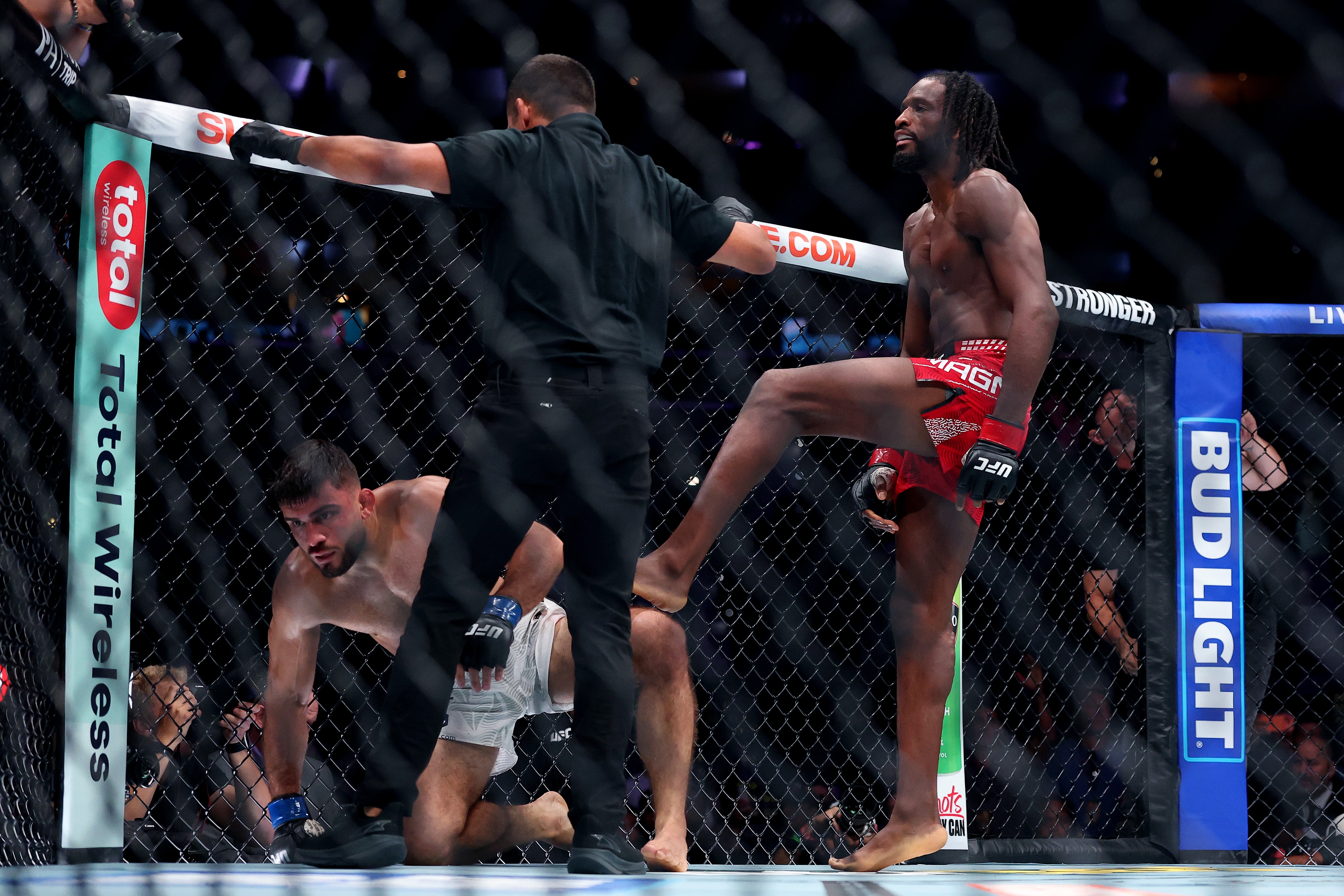 Neil Magny (right) celebrates his win over Ramiz Brahimaj