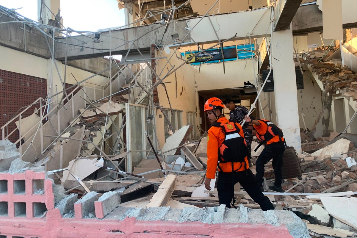 Rescuers dig through rubble and landslides after Indonesia quake kills 47