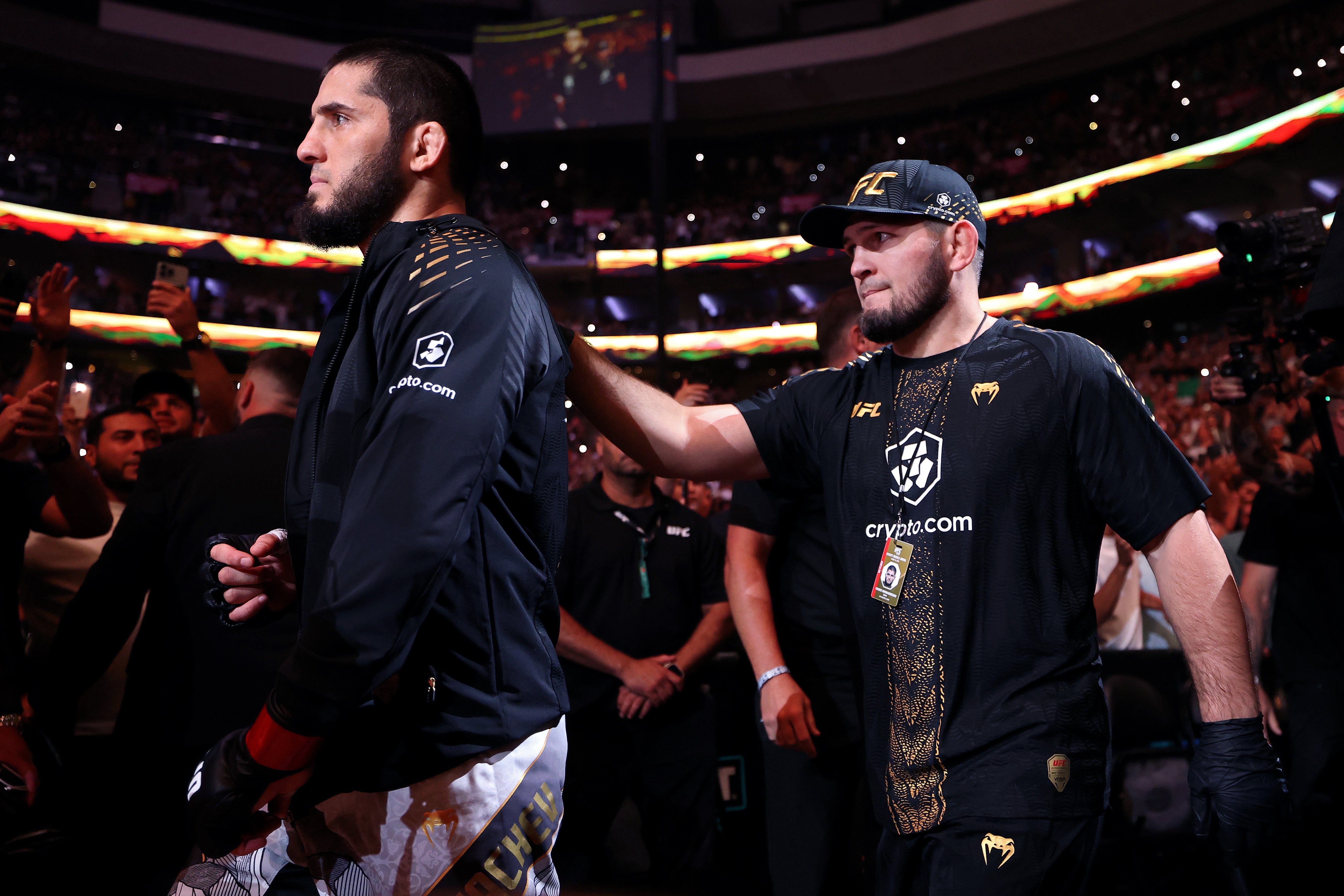 Khabib Nurmagomedov (right) walking out with Makhachev (Getty)