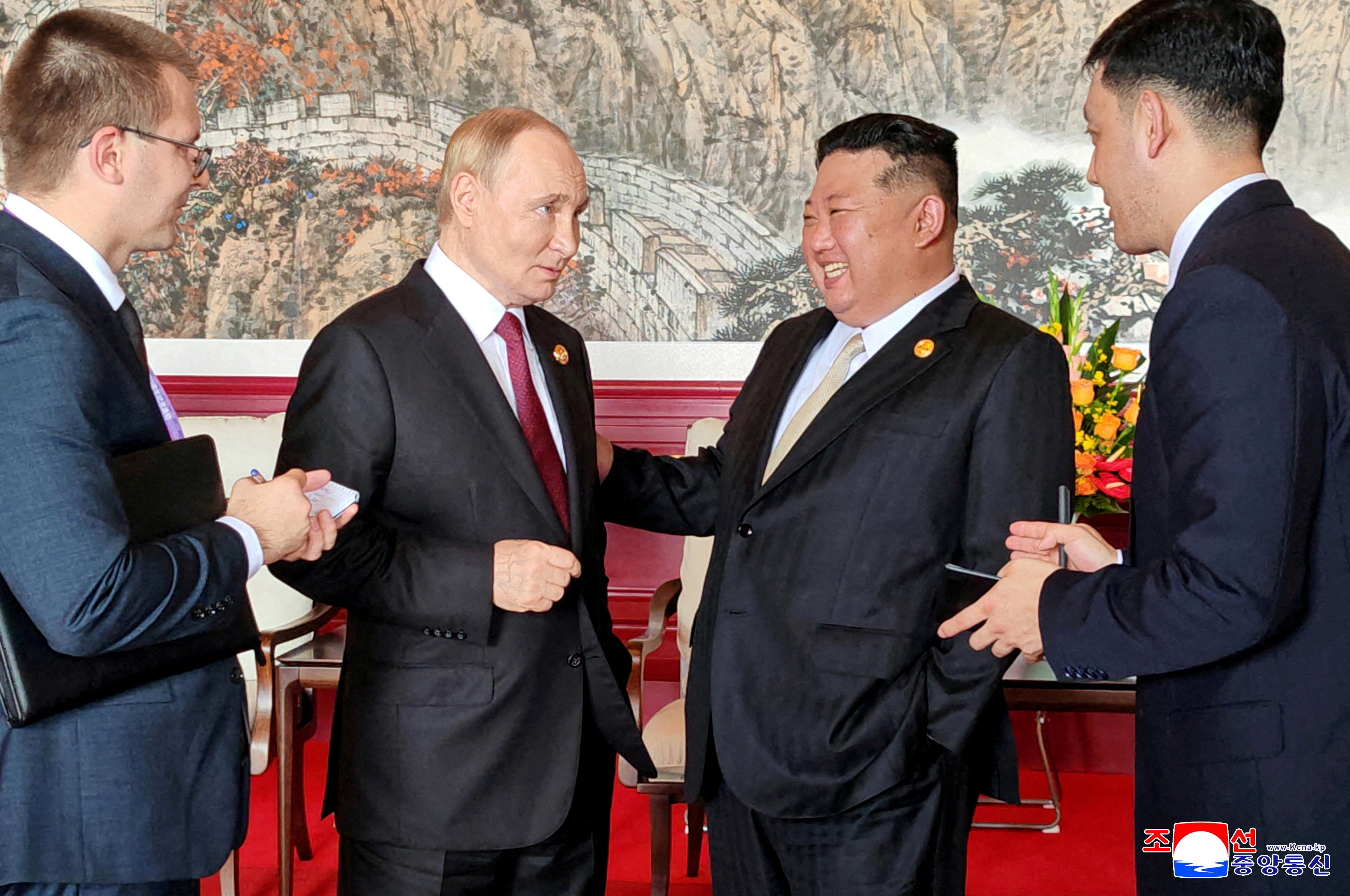 North Korean leader Kim Jong Un speaks with Russian President Vladimir Putin during their visit to Beijing to attend China's commemoration of the 80th anniversary of the end of World War Two, in Beijing, China, September 3, 2025