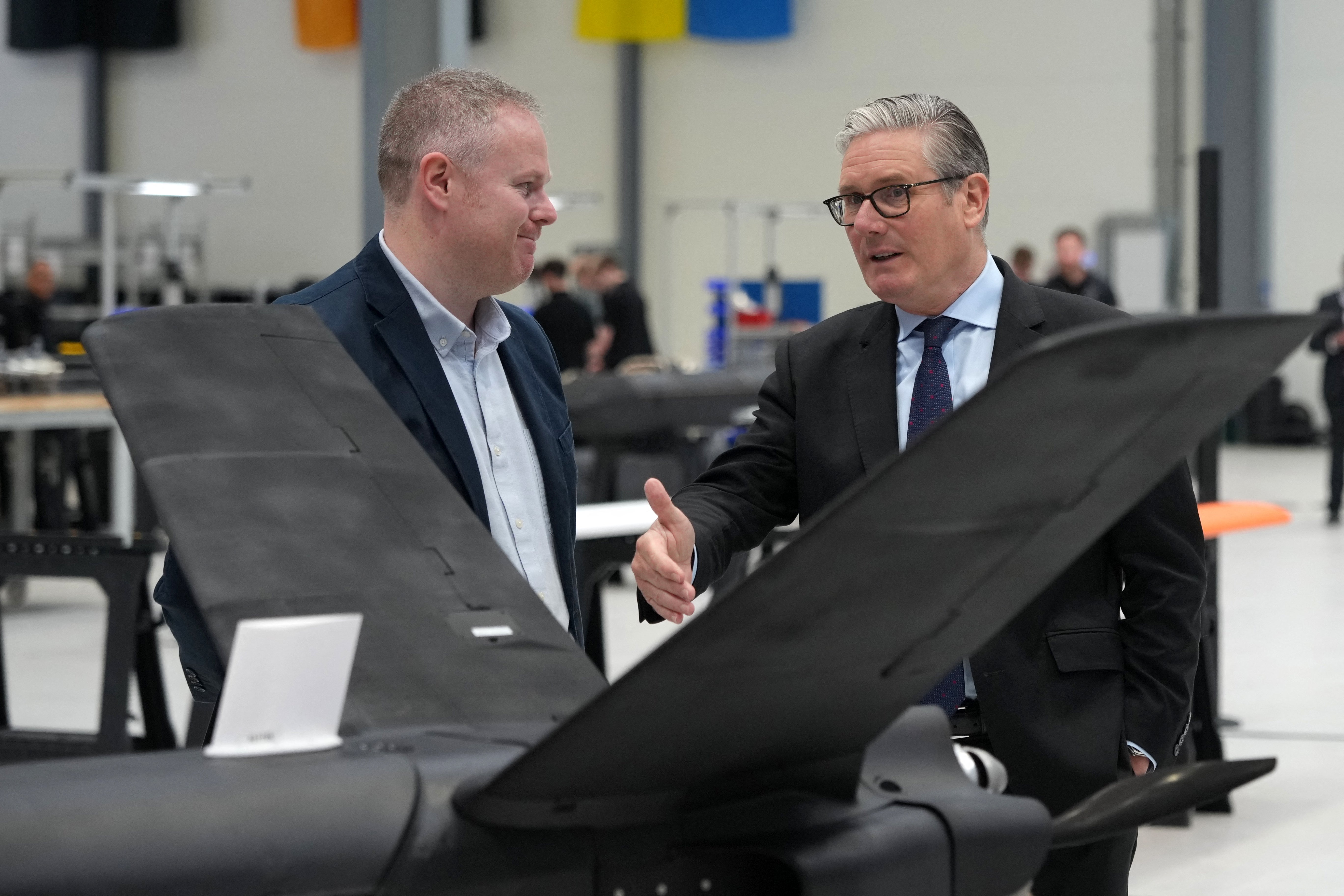 Former prime minister Keir Starmer looks at drones as he visits defence contractor Stark in Swindon in June (AFP/Getty)