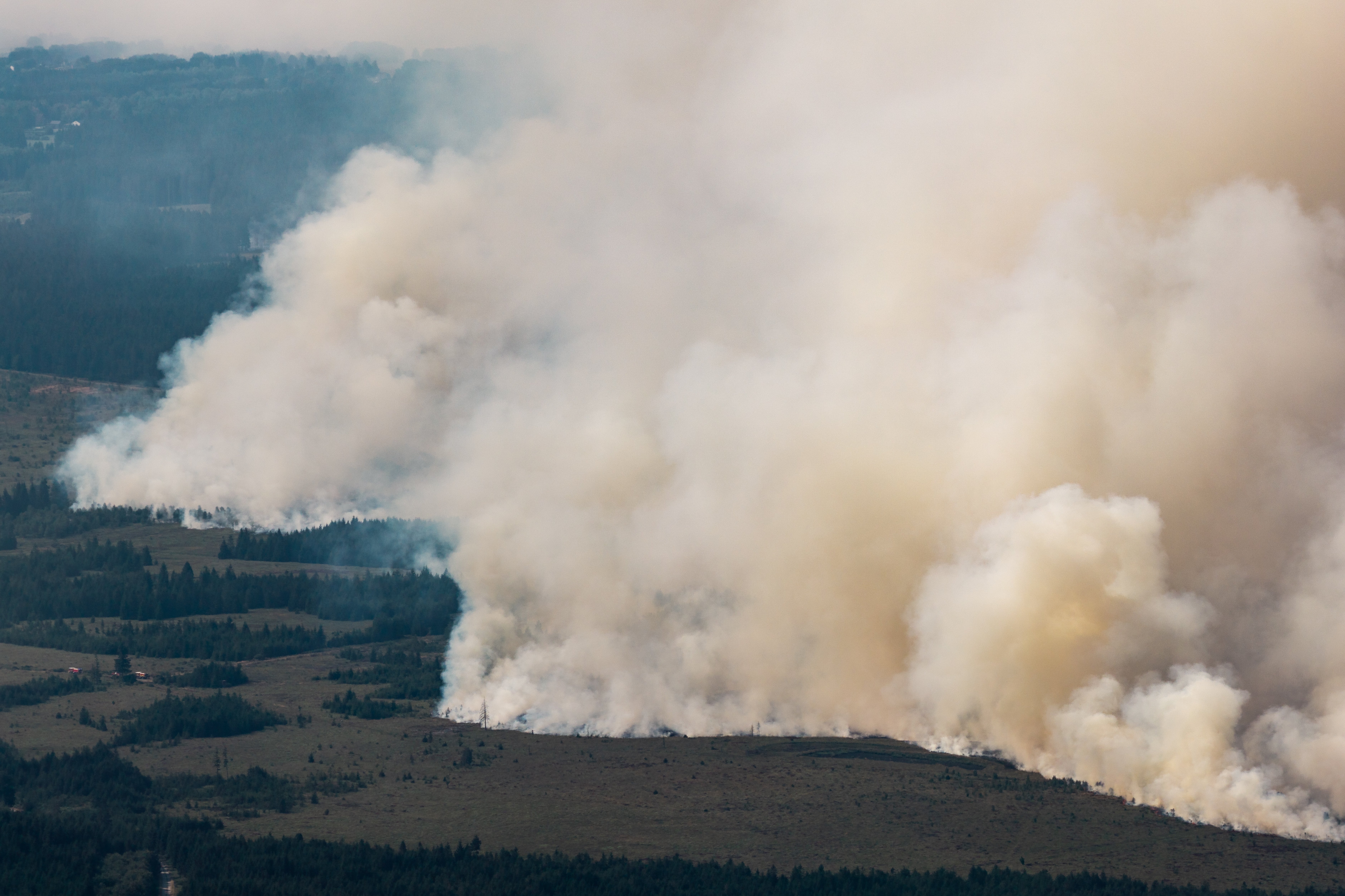 Smoke from a massive wildfire in Belgium's Hohes Venn region is seen from Germany on Aug. 16, 2026