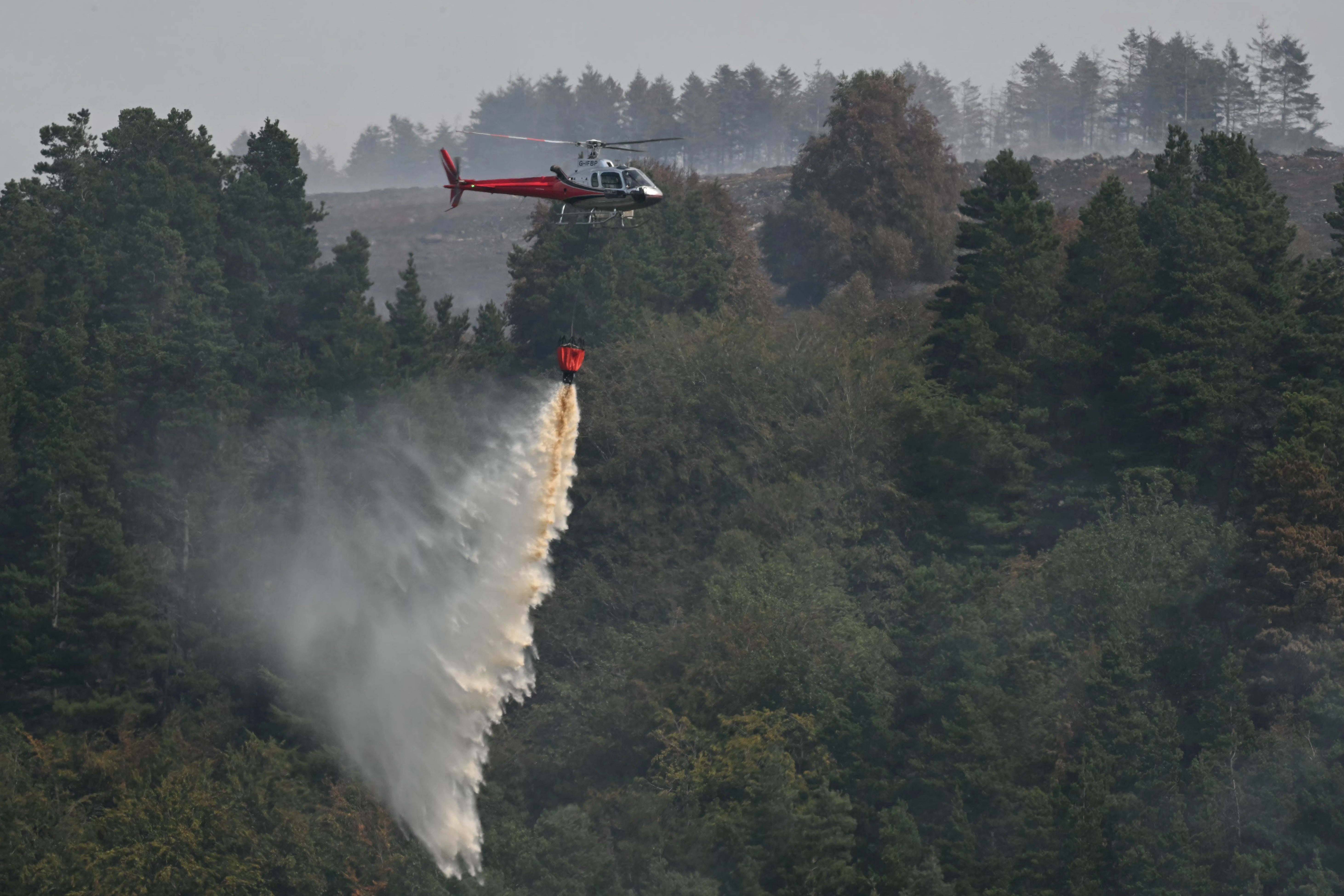 Firefighters are working in South Wales to battle wildfires