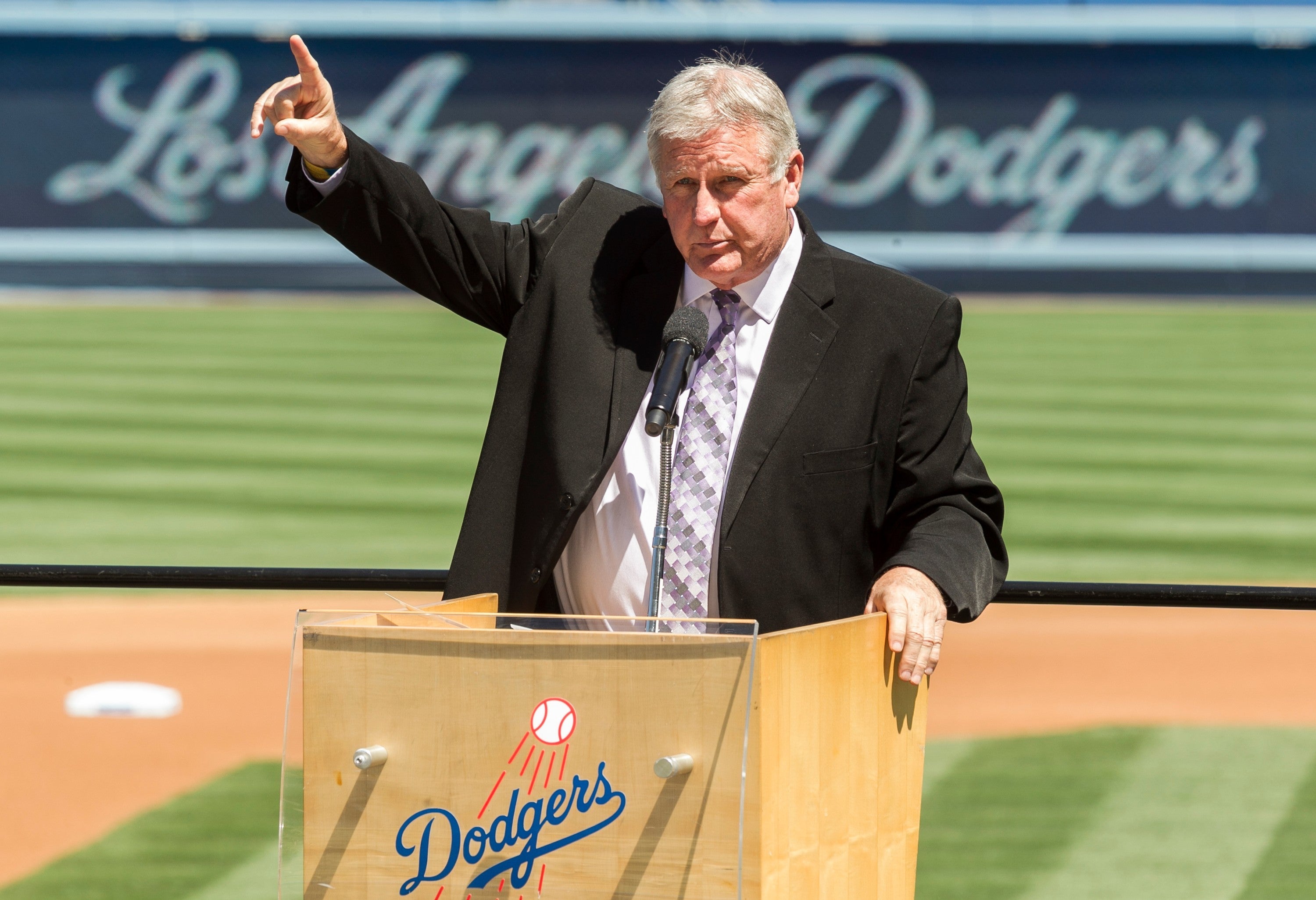 Tommy John praises his late friend, Dr. Frank Jobe during a memorial service at Dodger Stadium in Los Angeles, April 7, 2014