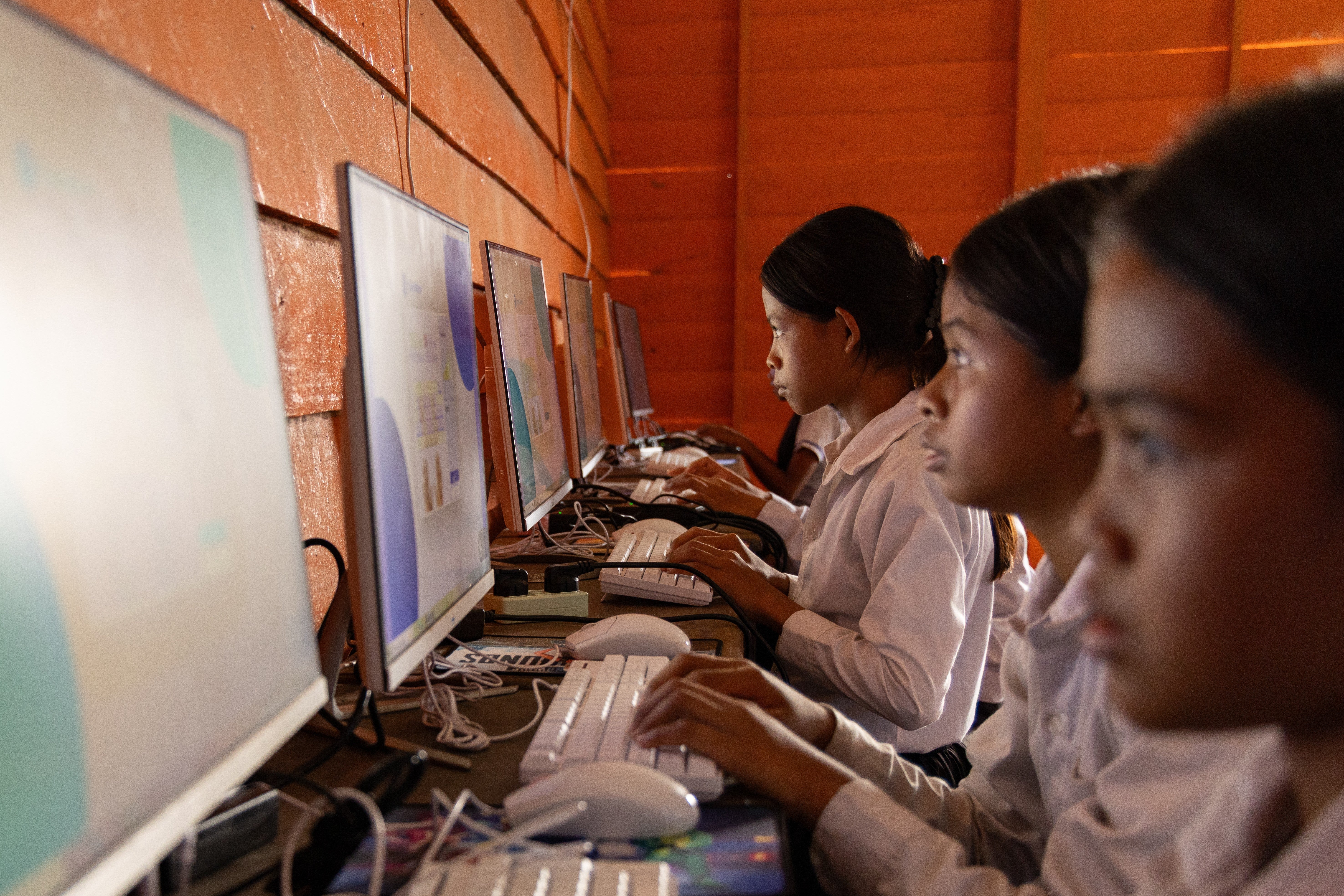 Students attend a computer class at a school in one of the floating villages of Cambodia's Tonle Sap Lake on Monday, June 29, 2026