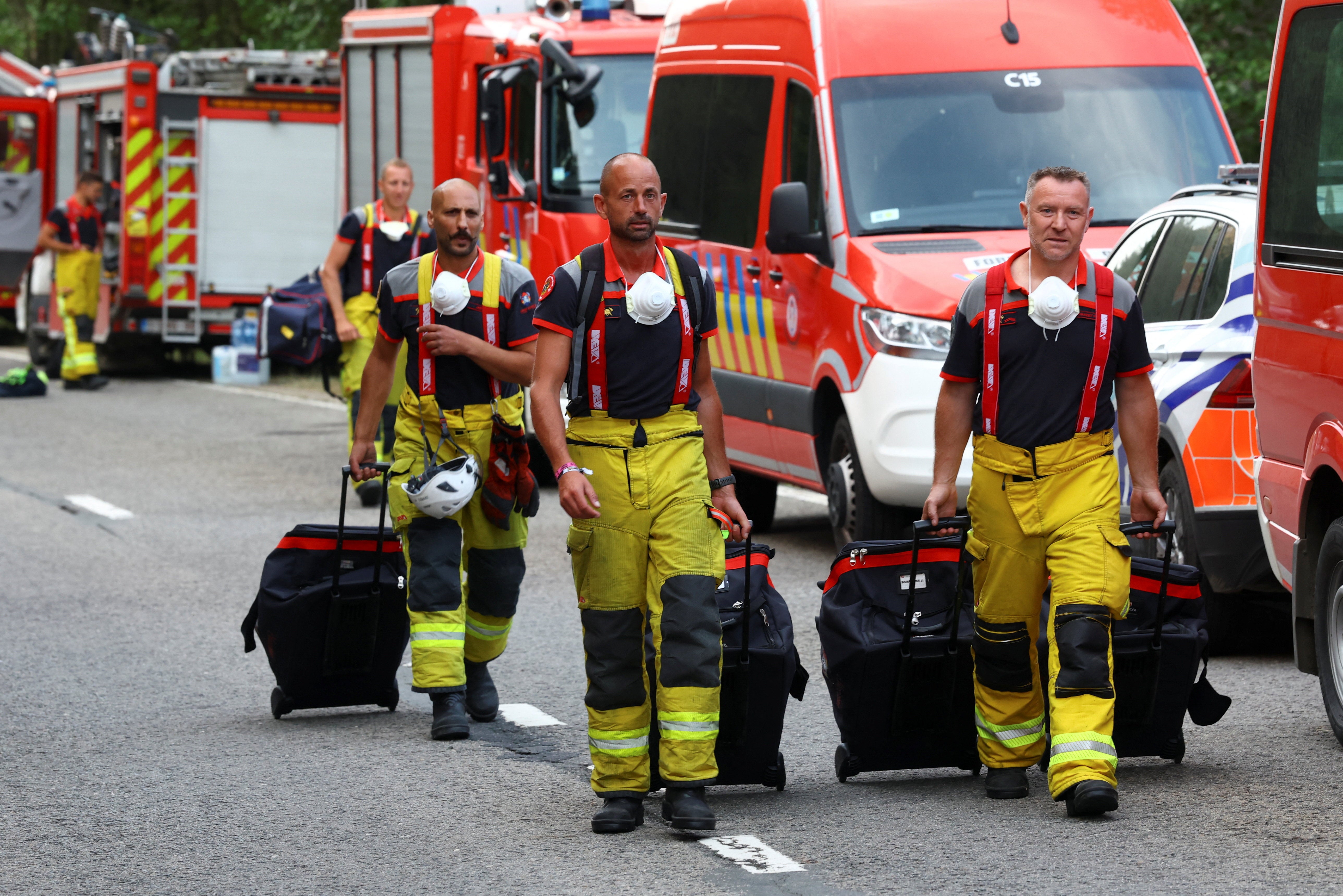 Firefighters arrive at a command post in Eupen, amid a wildfire in the High Fens (Hautes Fagnes) region, Belgium