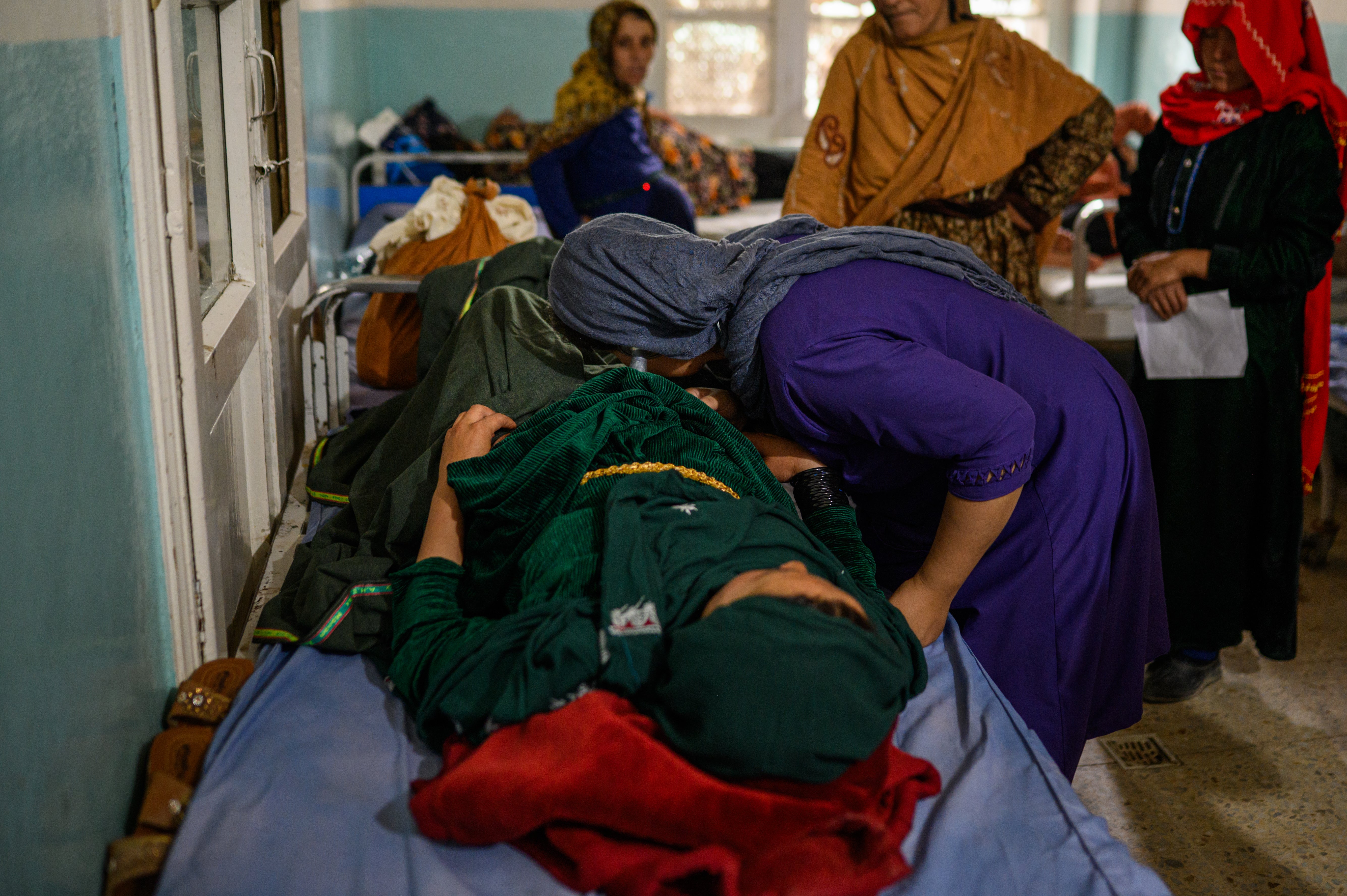 A midwife monitors pregnant women close to delivering at the provincial hospital's maternity department in Ghazni