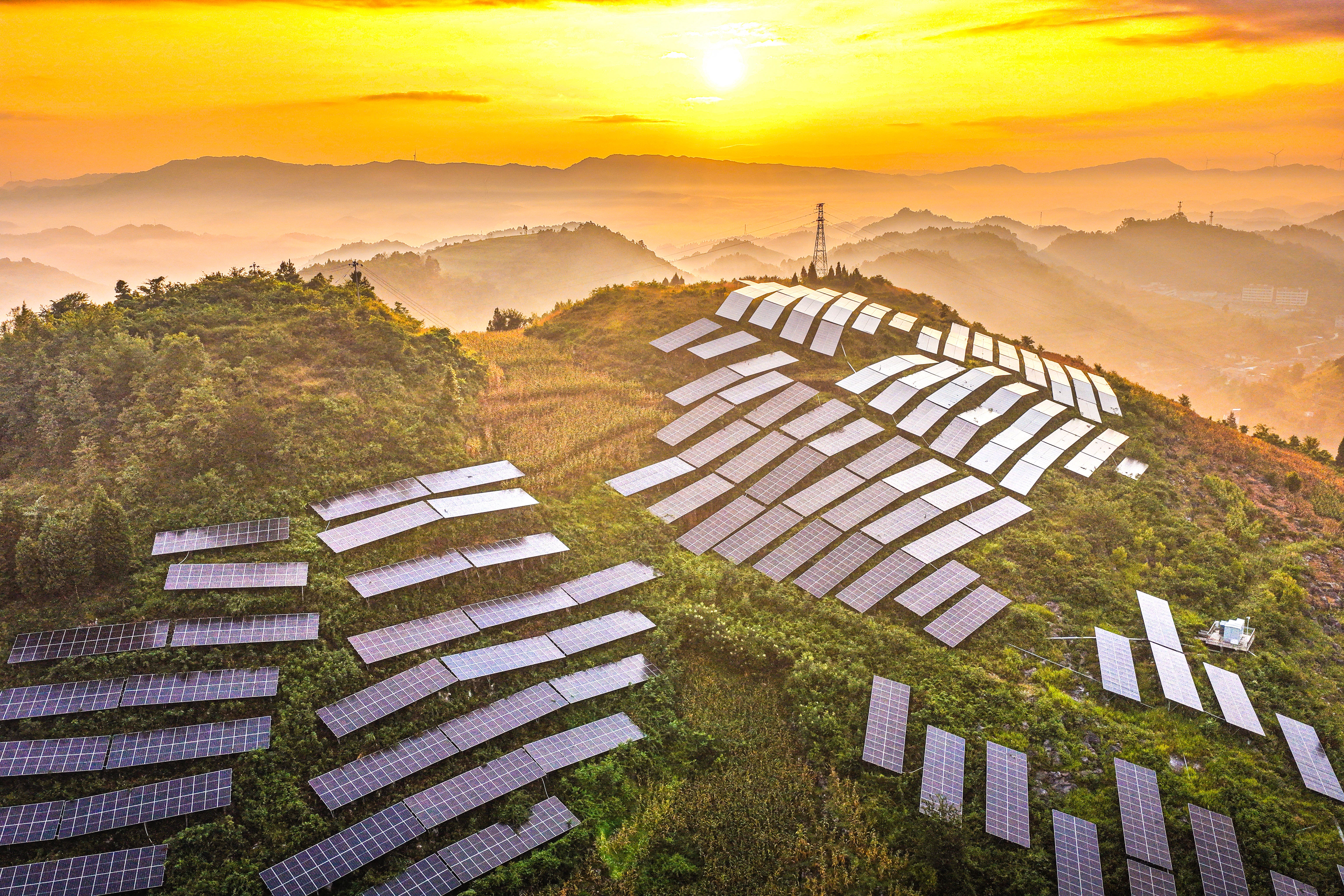 Solar panels are arranged on a hillside at an agricultural photovoltaic power station in Dingxin Yi and Miao Ethnic Township, Qianxi City, in southwestern China's Guizhou province (AFP/Getty)