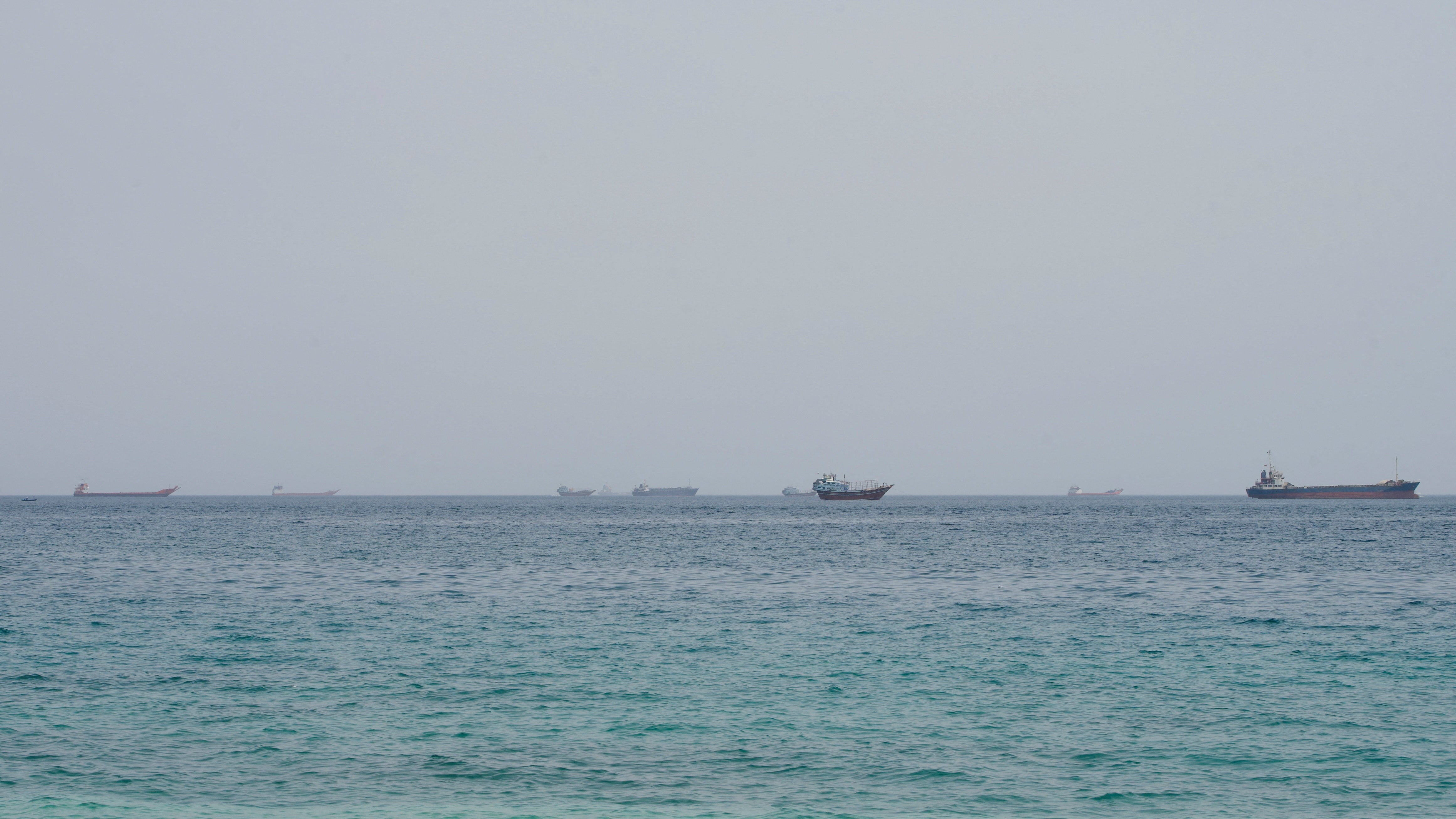 Vessels near the Strait of Hormuz, as seen from Musandam, Oman, August 10, 2026.