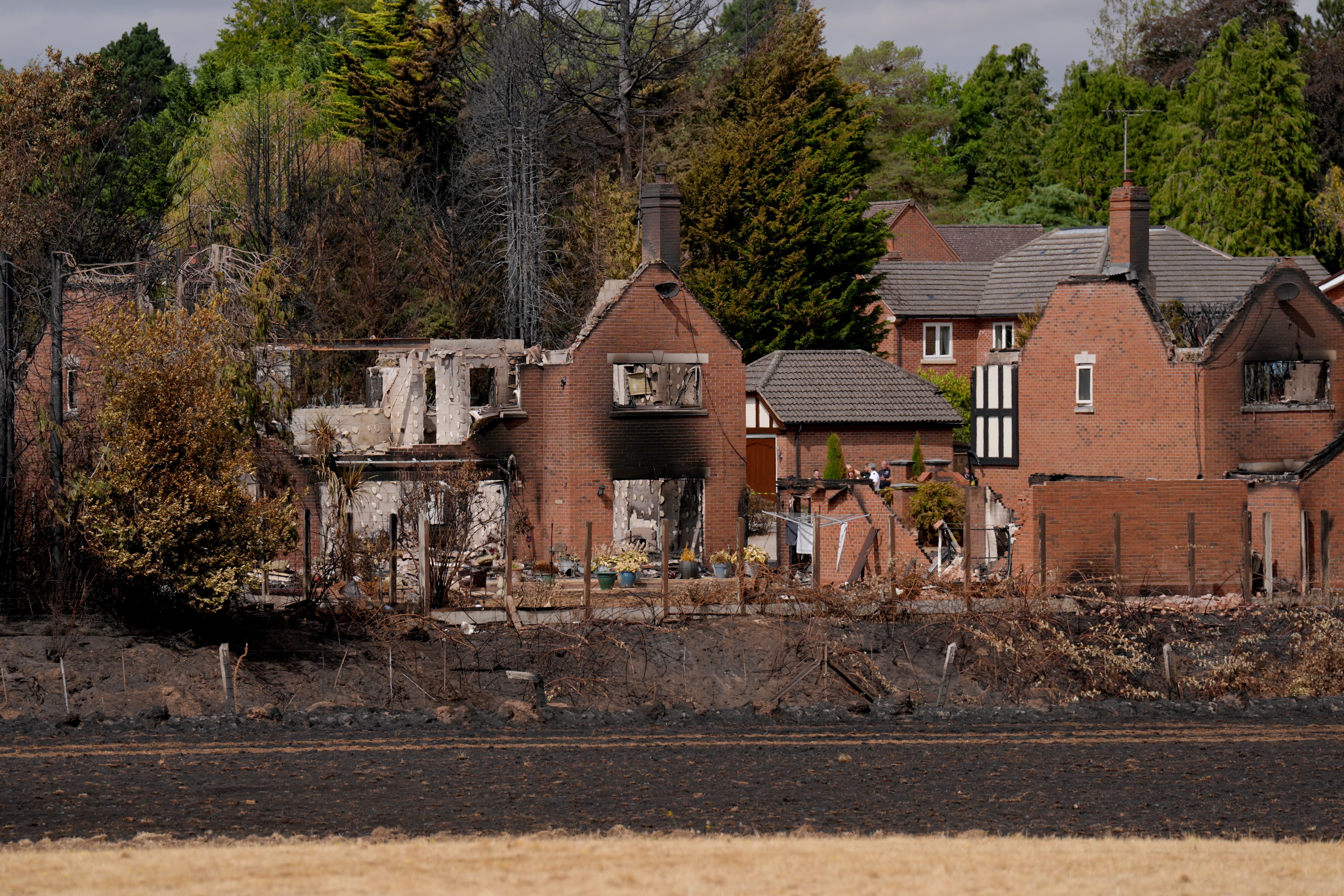 Remains of houses in Stourbridge, after a blaze destroyed 19 homes (Joe Giddens/PA) (PA Wire)