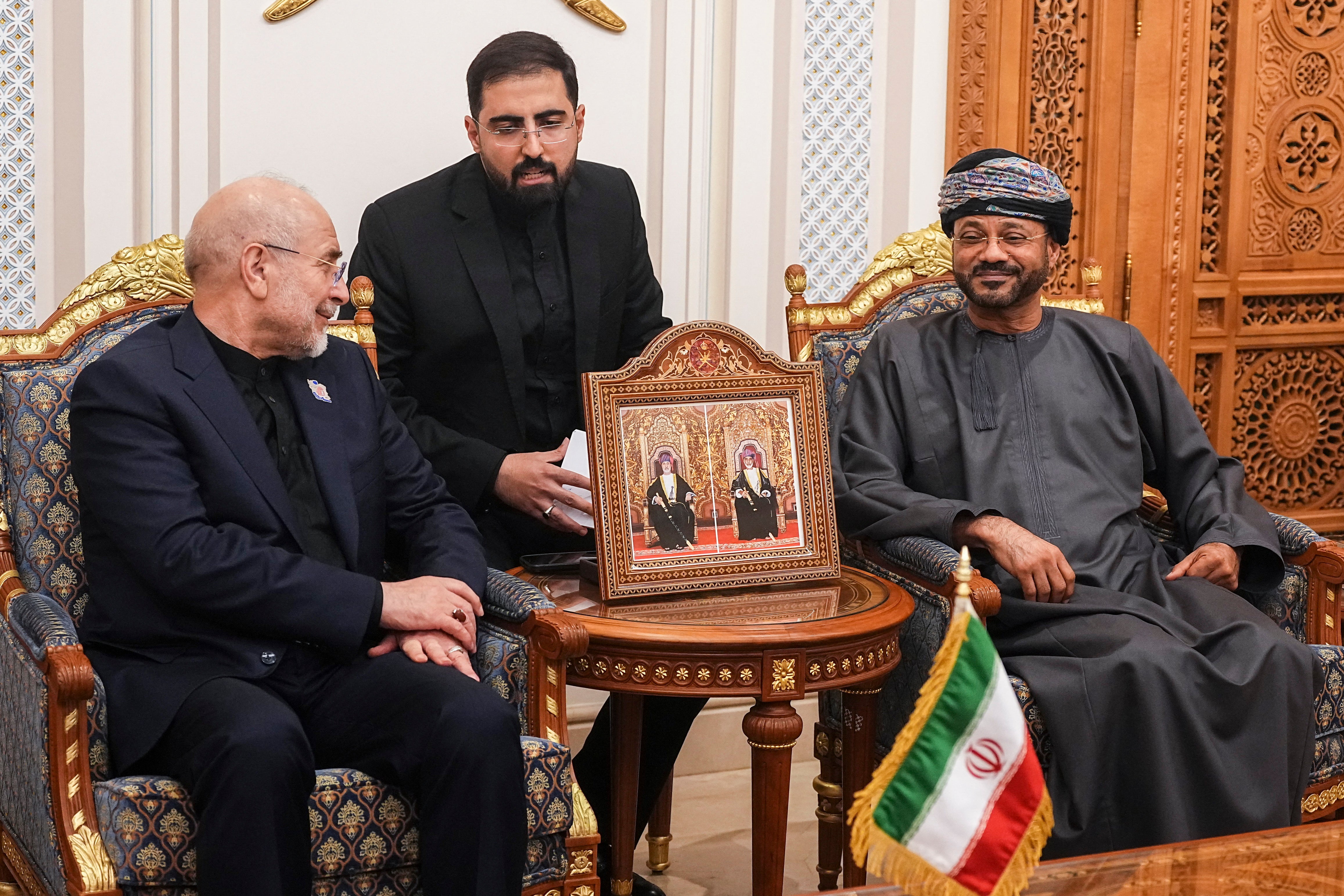 Iranian parliament speaker Mohammad Bagher Ghalibaf (L) speaks with Omani Foreign Minister Badr bin Hamad Al Busaidi (R) during a meeting in Muscat, Oman, on June 22, 2026.