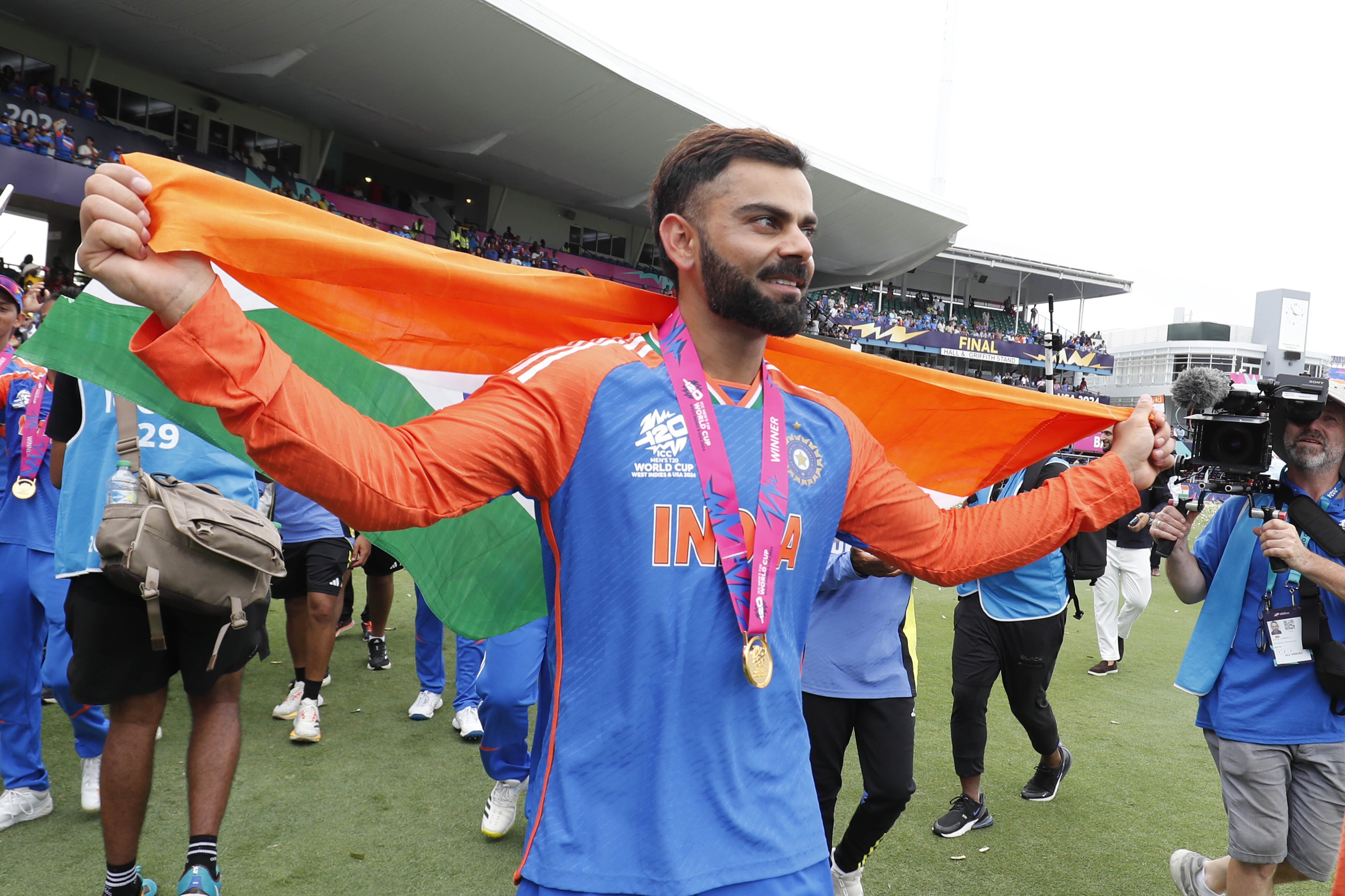 Jordan Cox cosied up to Virat Kohli, pictured, at the Indian Premier League (PA)