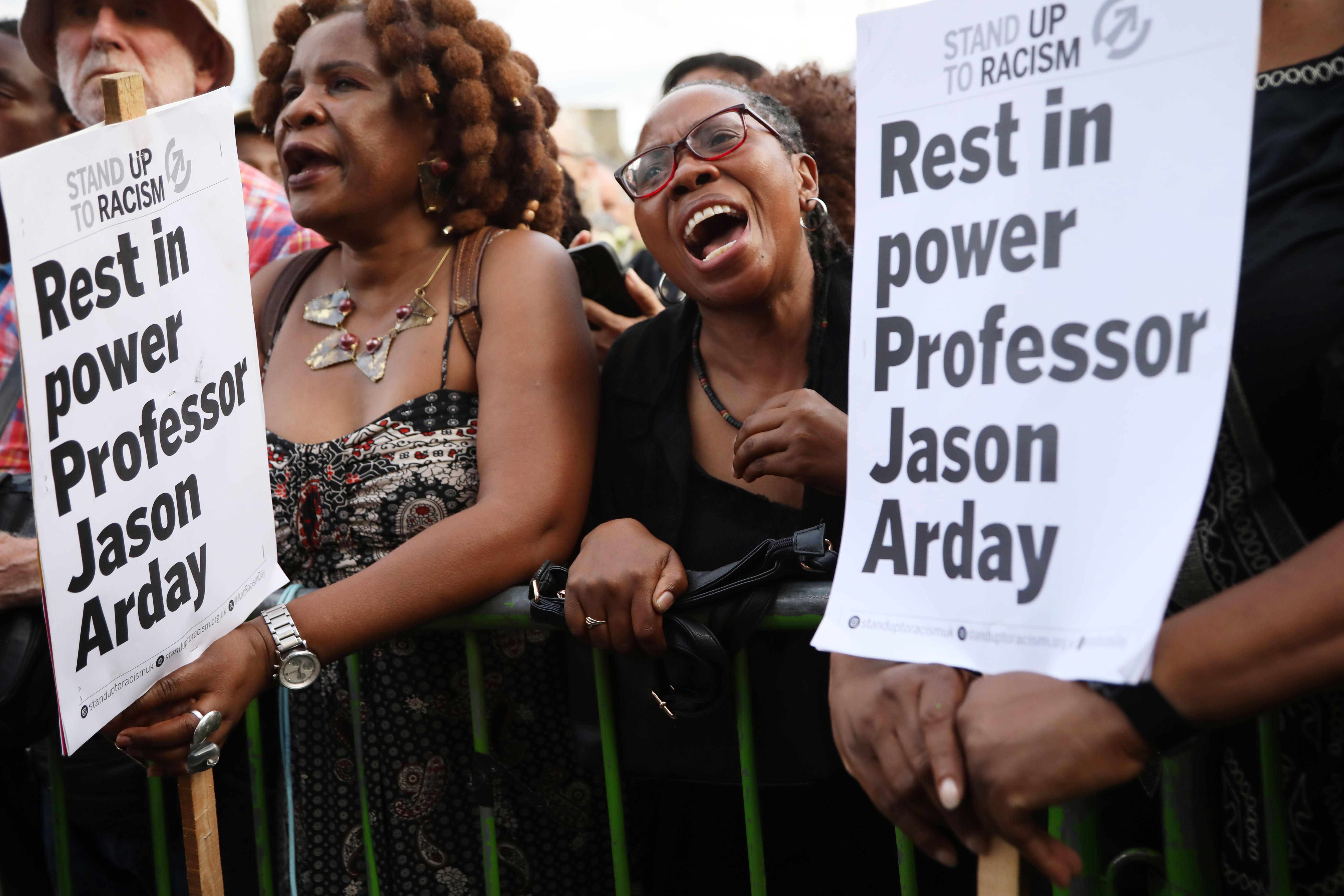 Attendees hold placards for Jason Arday (Getty)