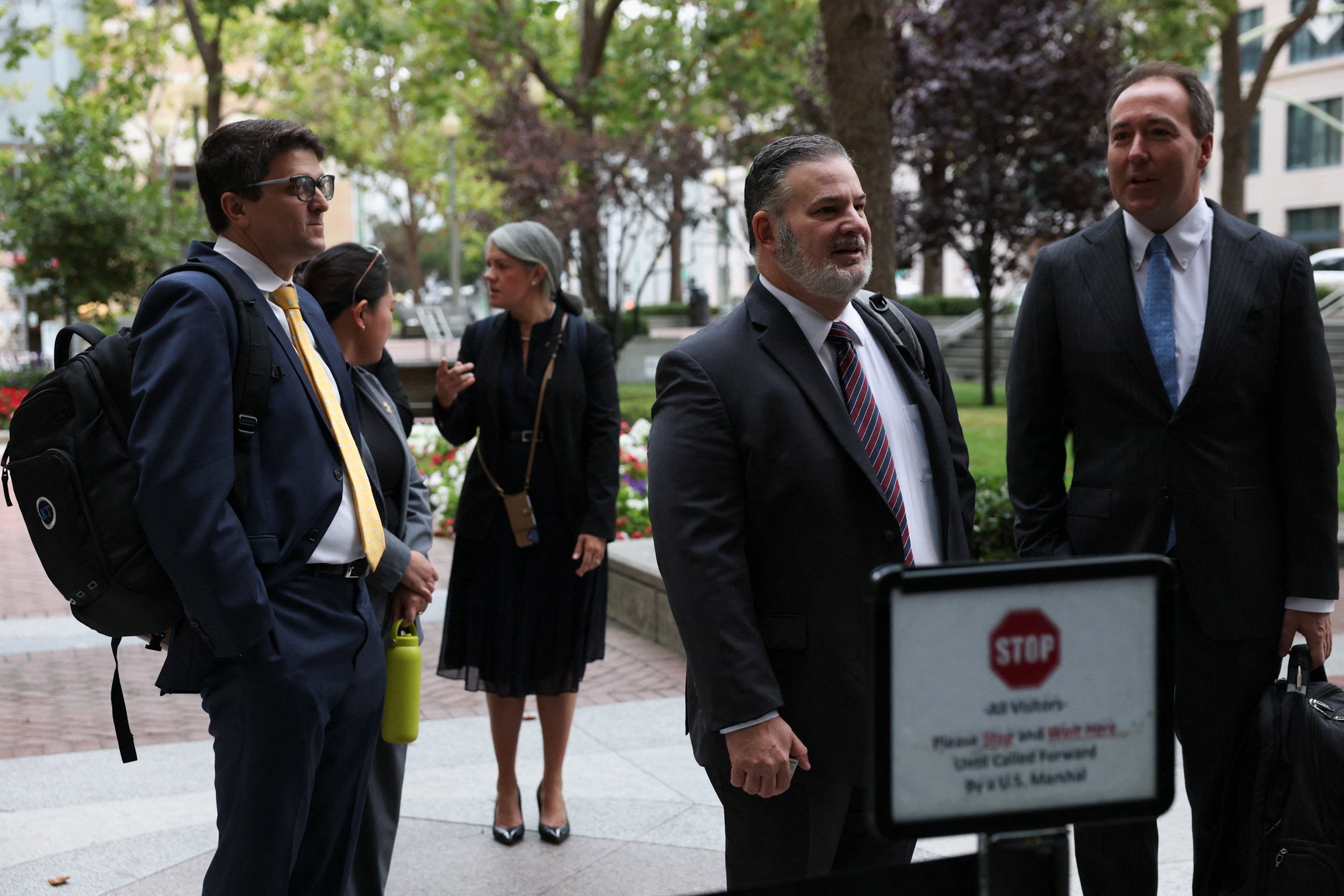 Slothouber and Kentucky’s consumer and senior protection deputy chief Chris Lewis stand in line outside a federal courthouse where a trial over allegations that Meta designed Facebook and Instagram to be addictive to children takes place (Reuters)