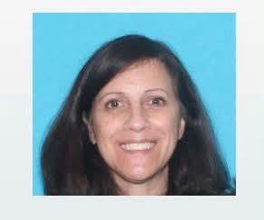 Woman who wrote book praising police officers is wanted after cop died in her home