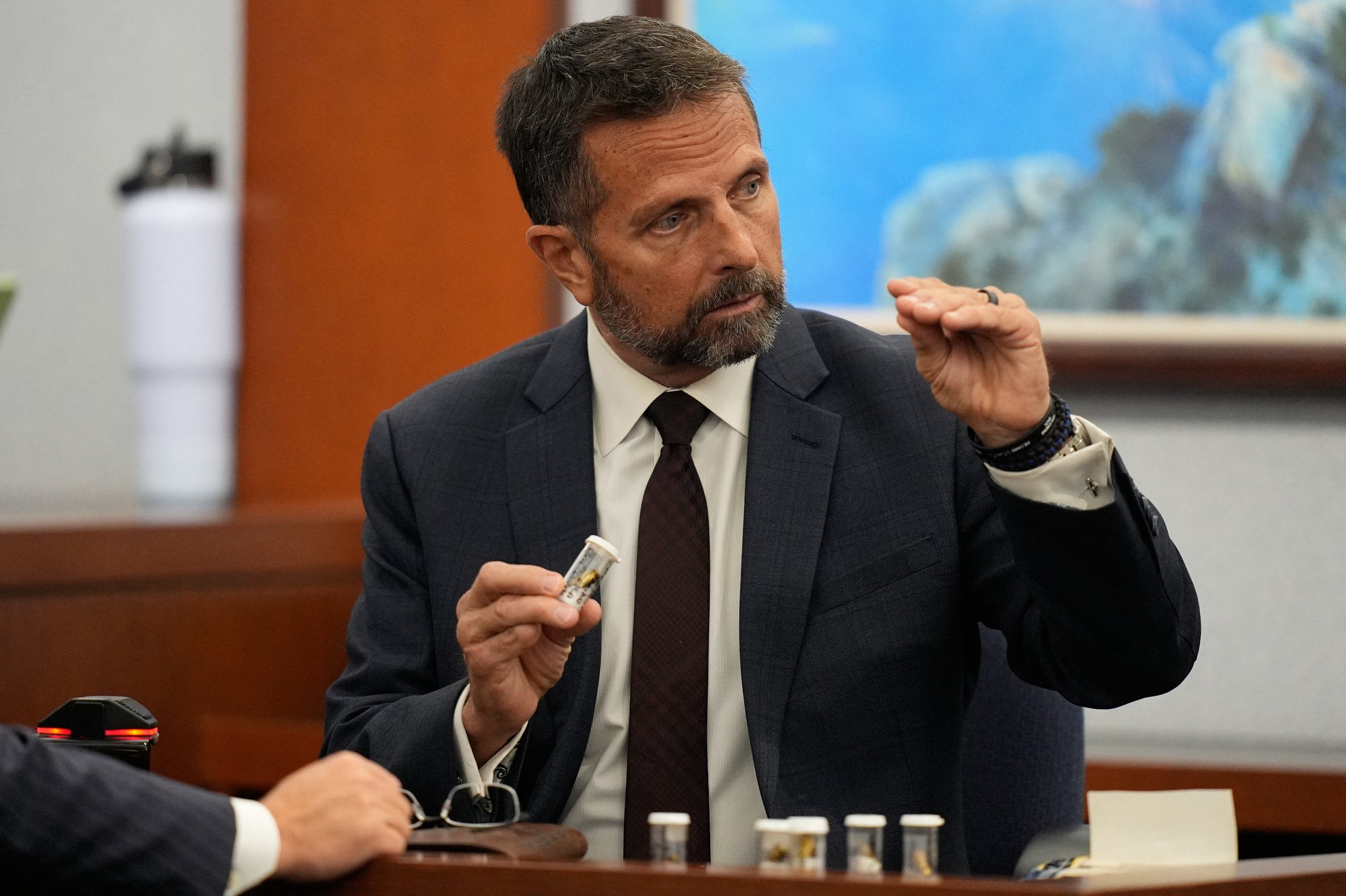 Dean O’Kelley, a former Las Vegas police officer, testified to finding several cartridges on the street at the scene, (John Locher / AFP via Getty Images)