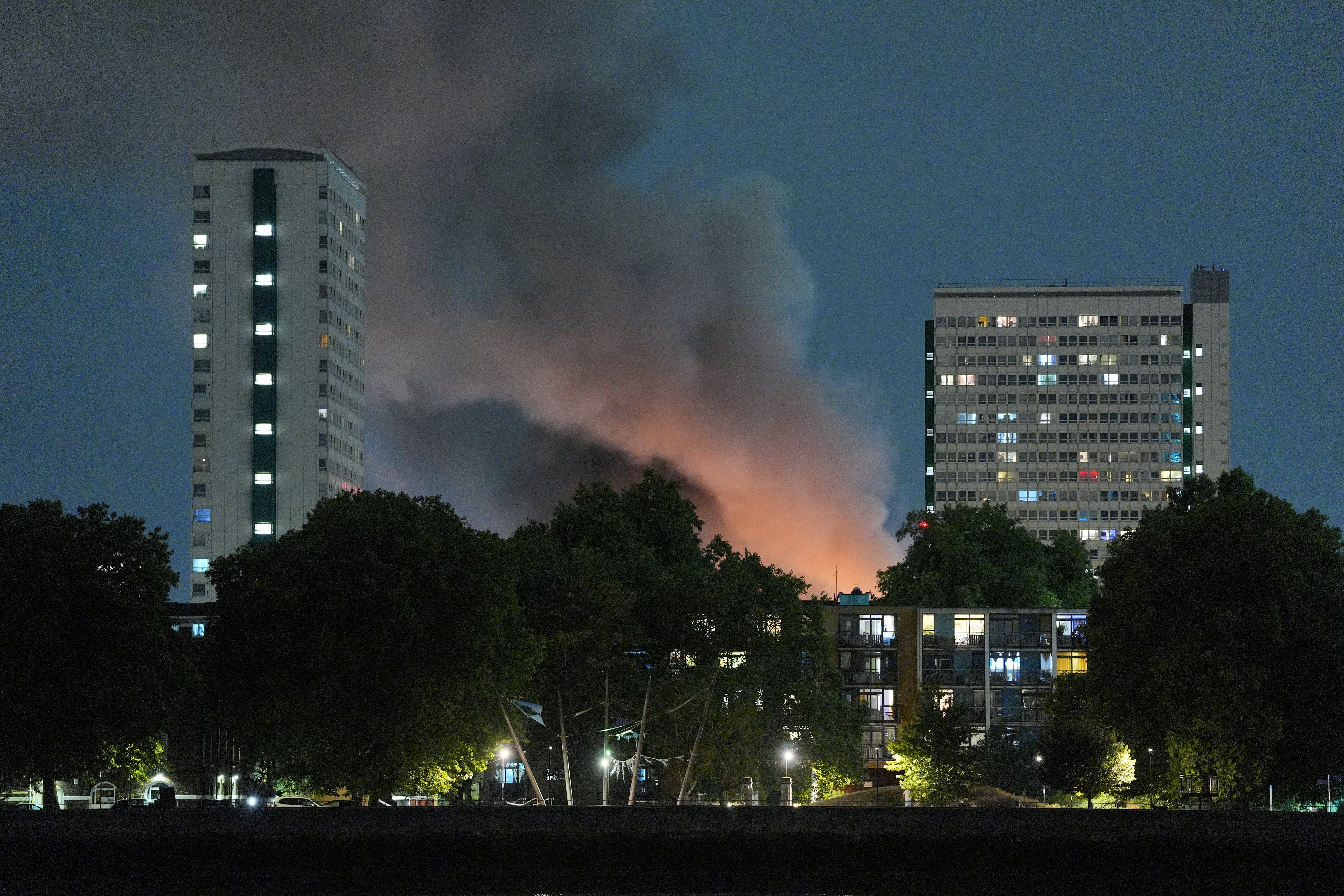 Smoke and flames from a blaze on Landmann Way, in Deptford as seen from Millwall
