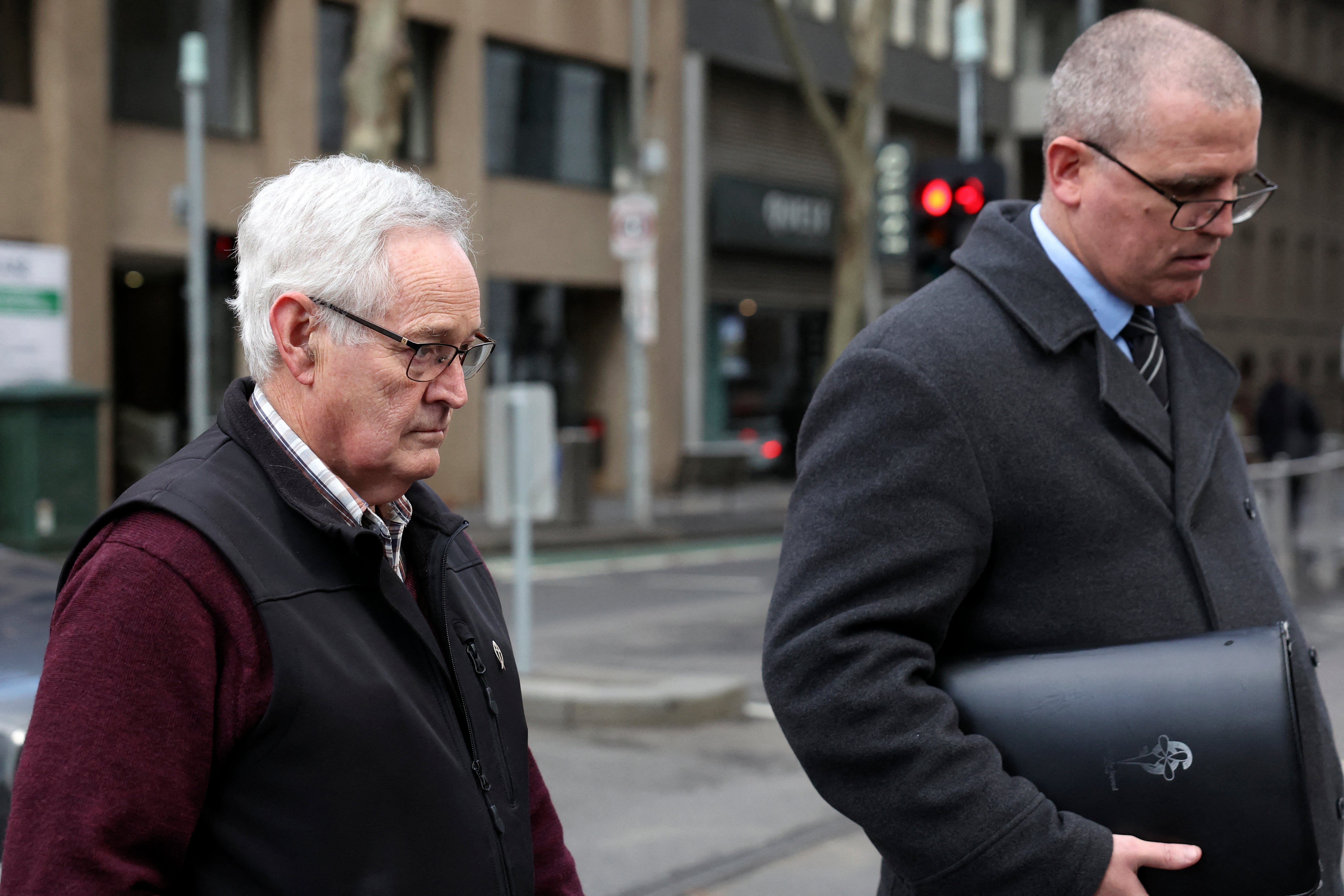 Ian Wilkinson, L, the only guest to survive the toxic mushroom lunch prepared by Erin Patterson, leave the Supreme Court of Victoria after the first day of the appeal hearing in Melbourne on 19 August 2026