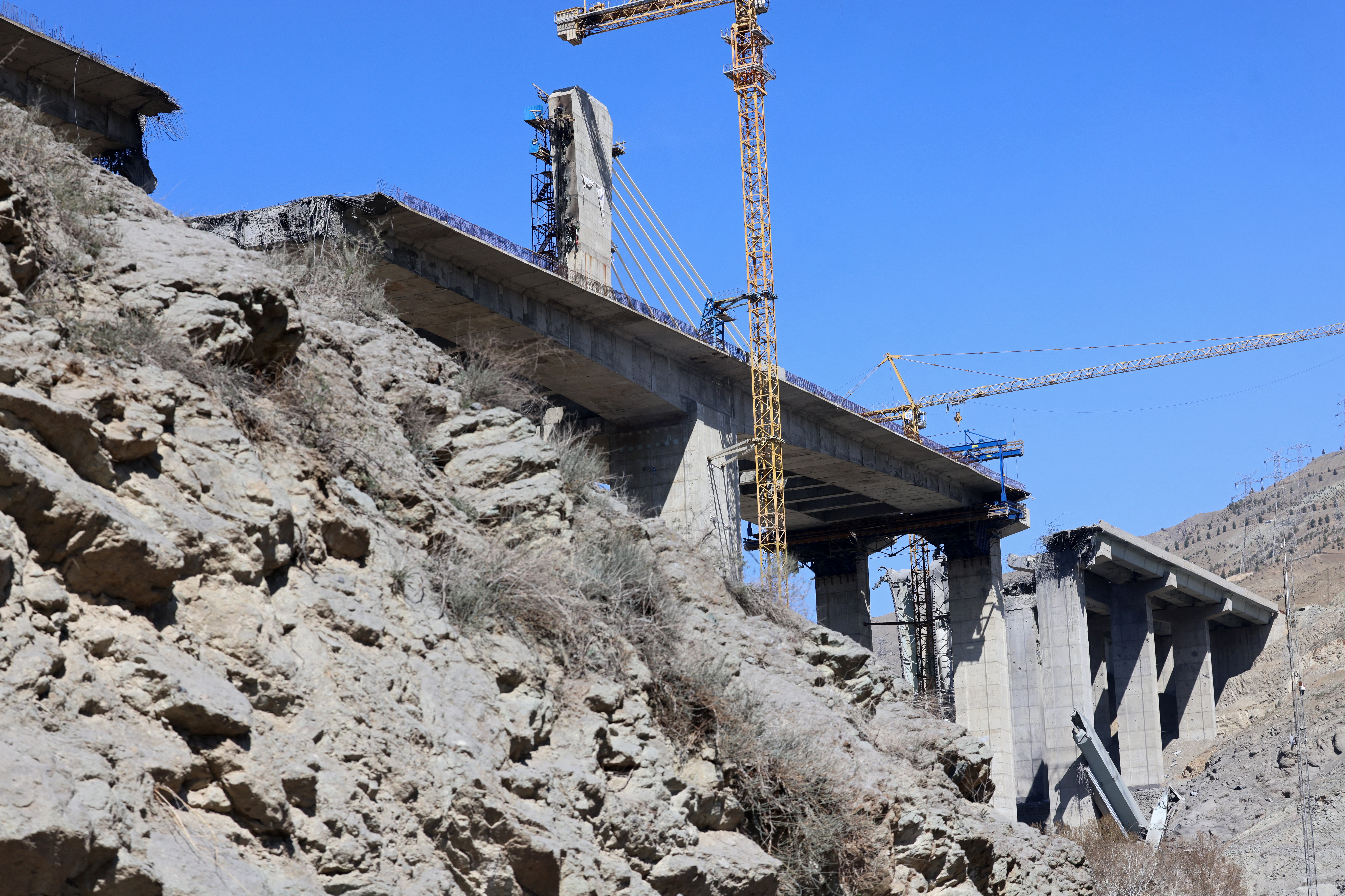A view of the B1 bridge is pictured, a day after it was destroyed by a strike in Karaj, around 20miles (35kms) southwest of Tehran