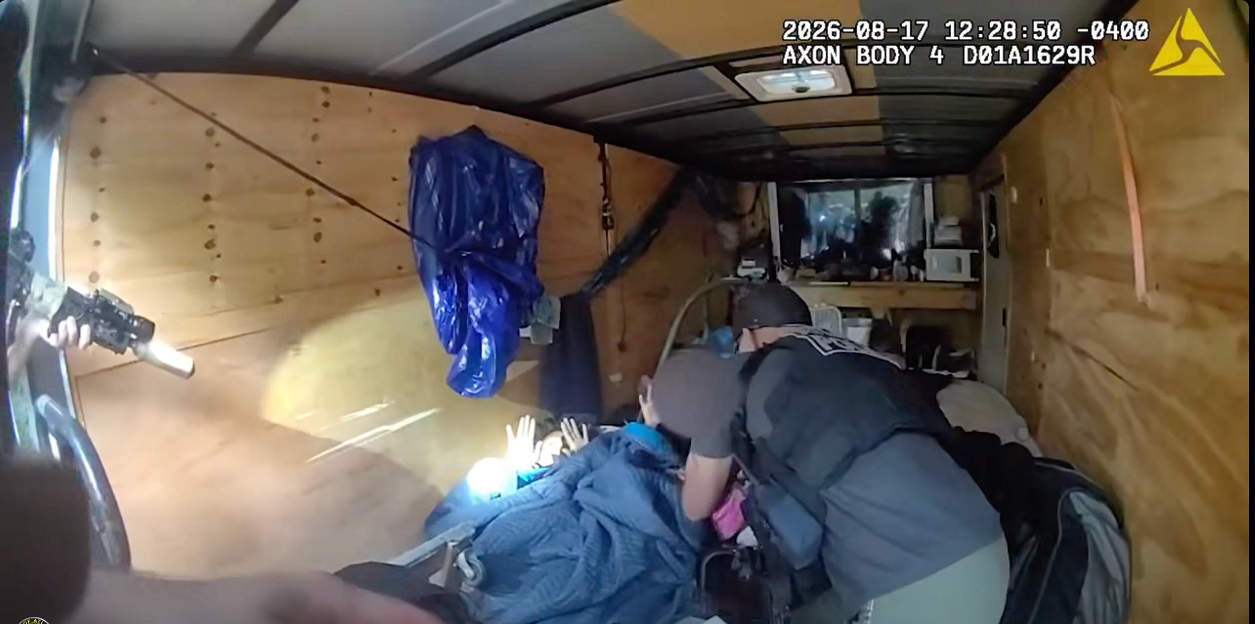 Police ordered Lakesha Brown, 42, to raise her hands before removing her from the trailer (Atlanta Police Department)