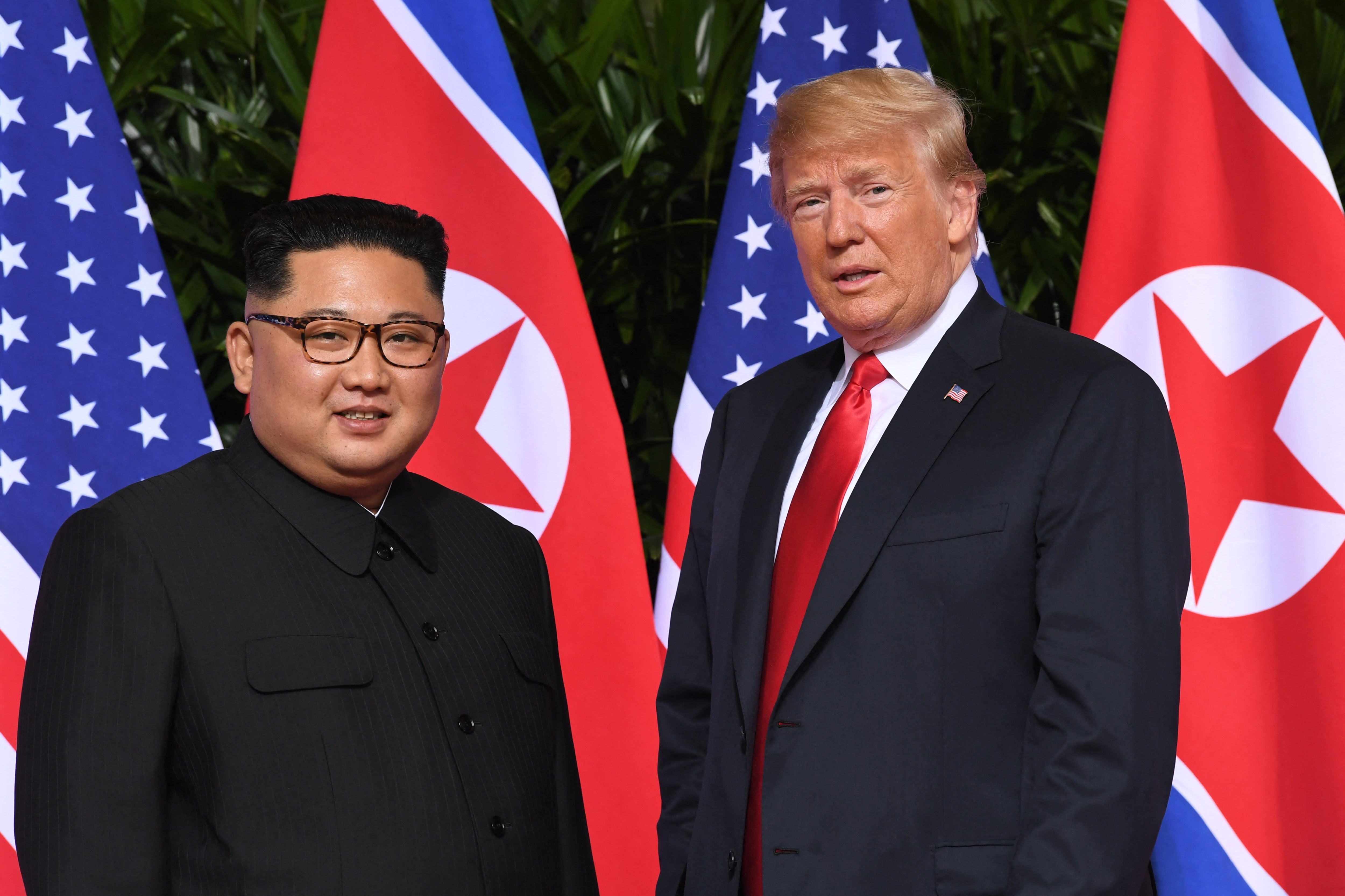 North Korean leader Kim Jong Un and US president Donald Trump at the start of their summit in Singapore on 12 June 2018