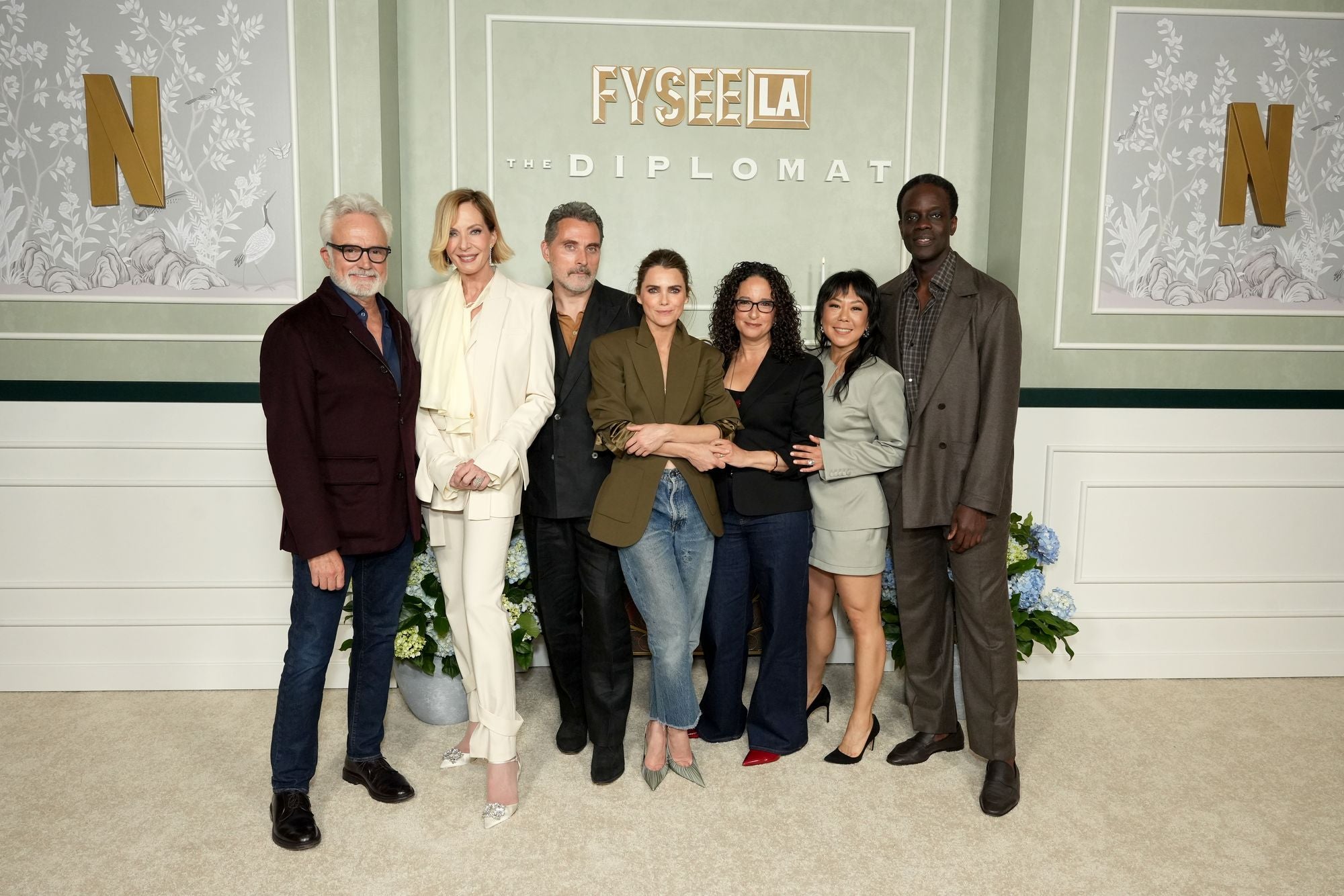 Janney (second from the left) is often taller than even her male co-stars (Getty Images for Netflix)