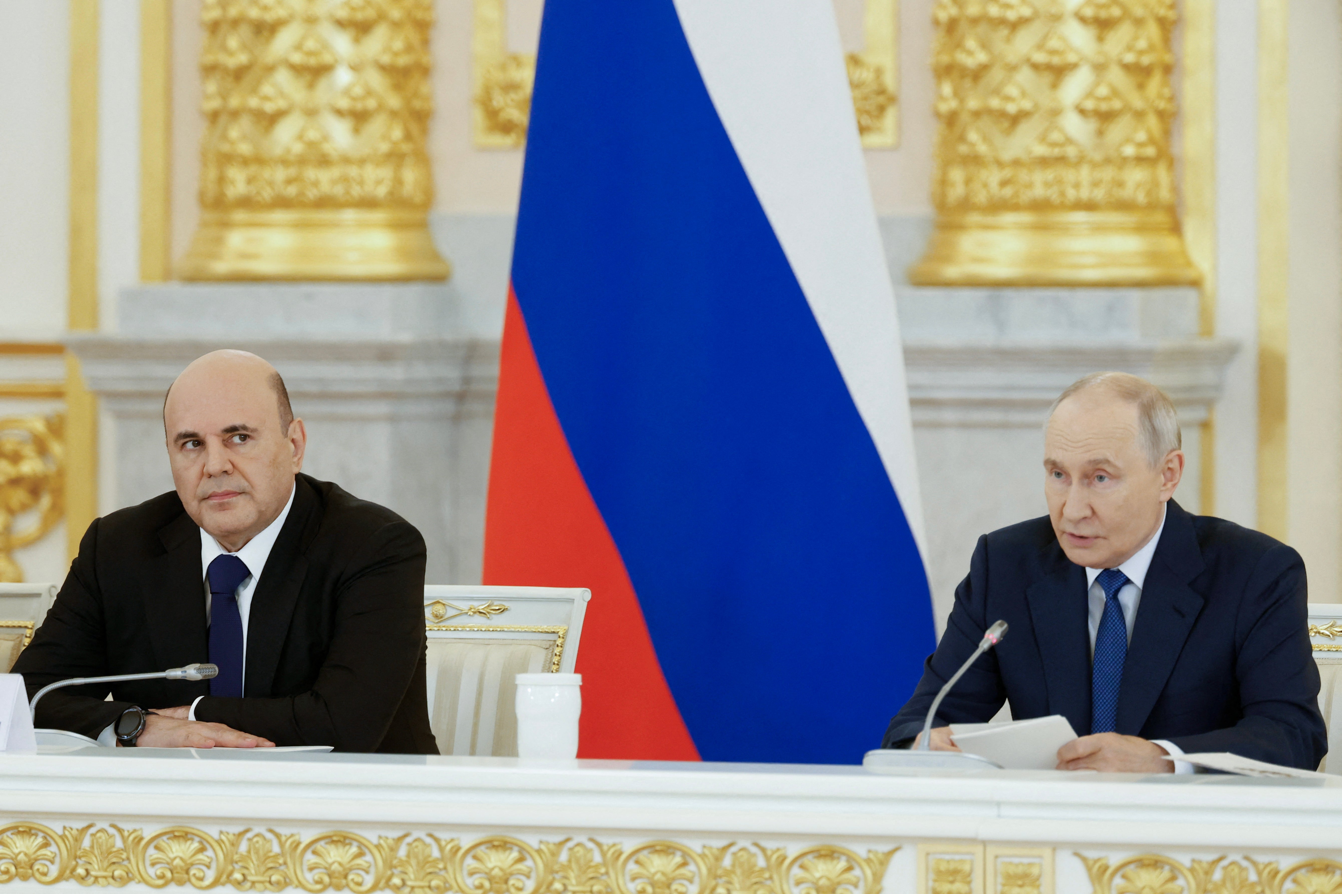 In this pool photograph distributed by the Russian state agency Sputnik, Russia's President Vladimir Putin (R), sitting next to Russian Premier Mikhail Mishustin (L), chairs a meeting of the Council for Strategic Development and National Projects at the Kremlin in Moscow on August 19, 2026. (AFP/Getty)