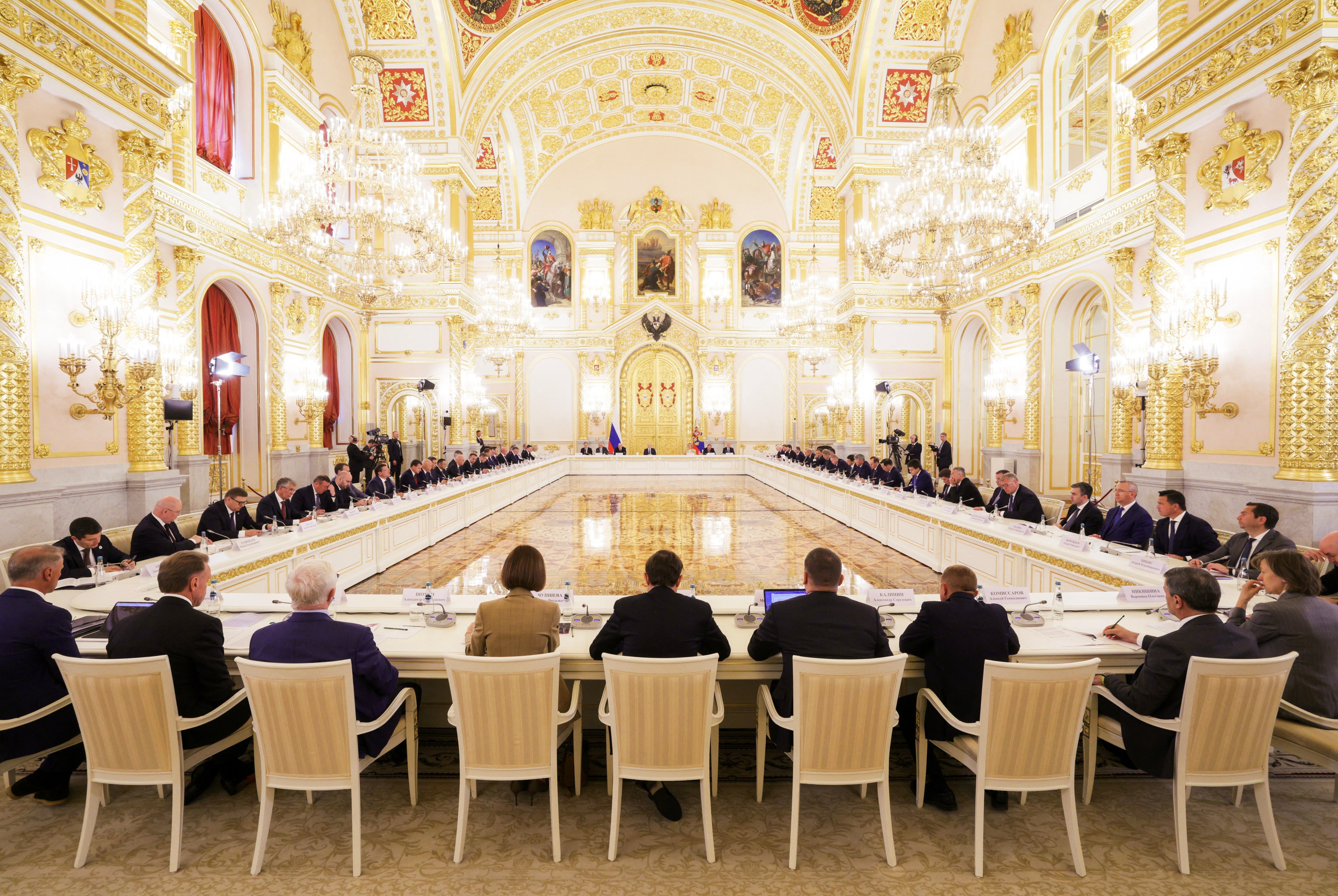 In this pool photograph distributed by the Russian state agency Sputnik, Russia's President Vladimir Putin (back C) chairs a meeting of the Council for Strategic Development and National Projects at the Kremlin in Moscow on August 19, 2026 (AFP/Getty)