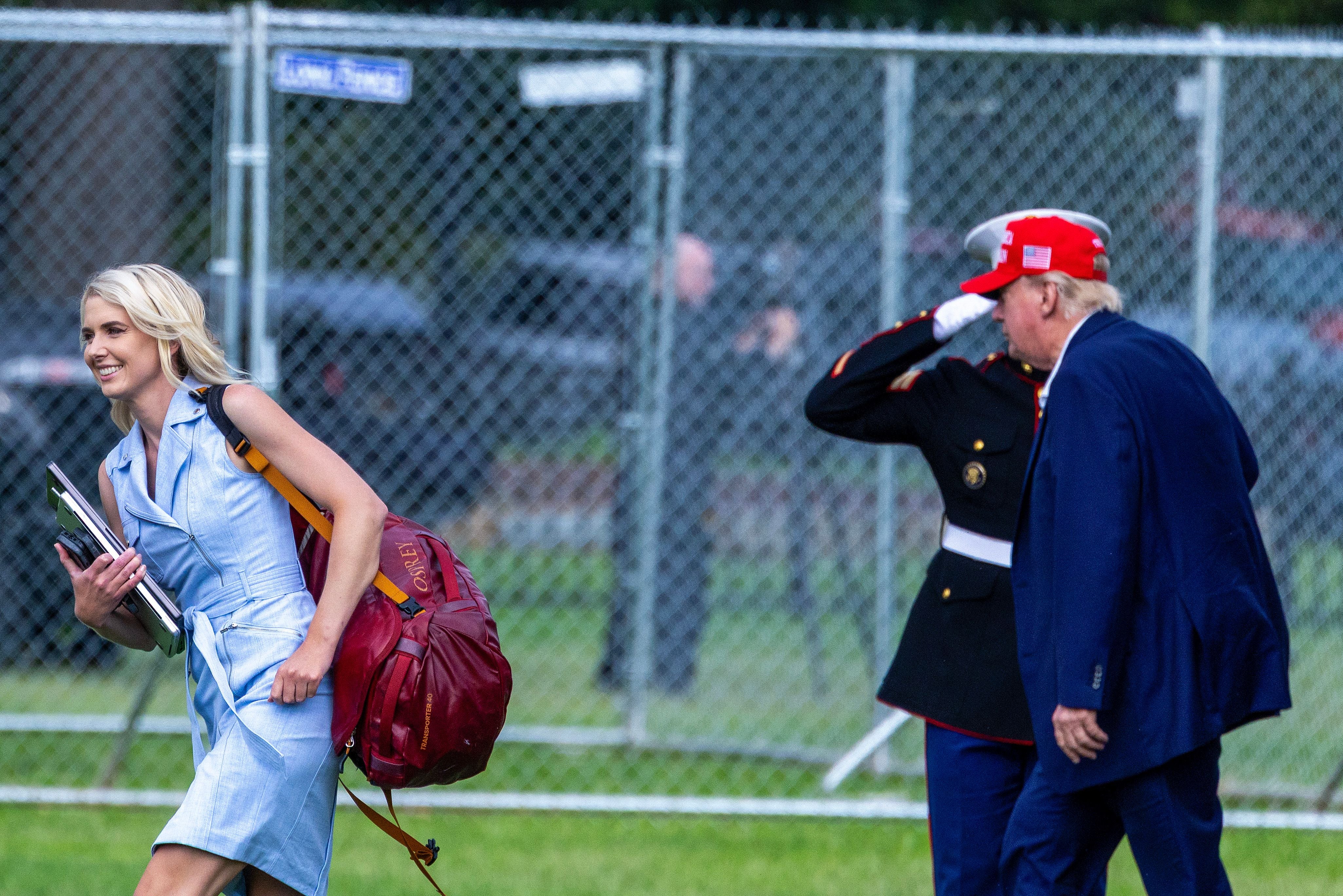 In recent months, Harp has attracted intense media scrutiny, due in part to her near-constant presence at Trump’s side and what some perceive as an unusually fervent devotion to him. Pictured: Trump and Harp walk after landing at the Ellipse near the White House on August 16