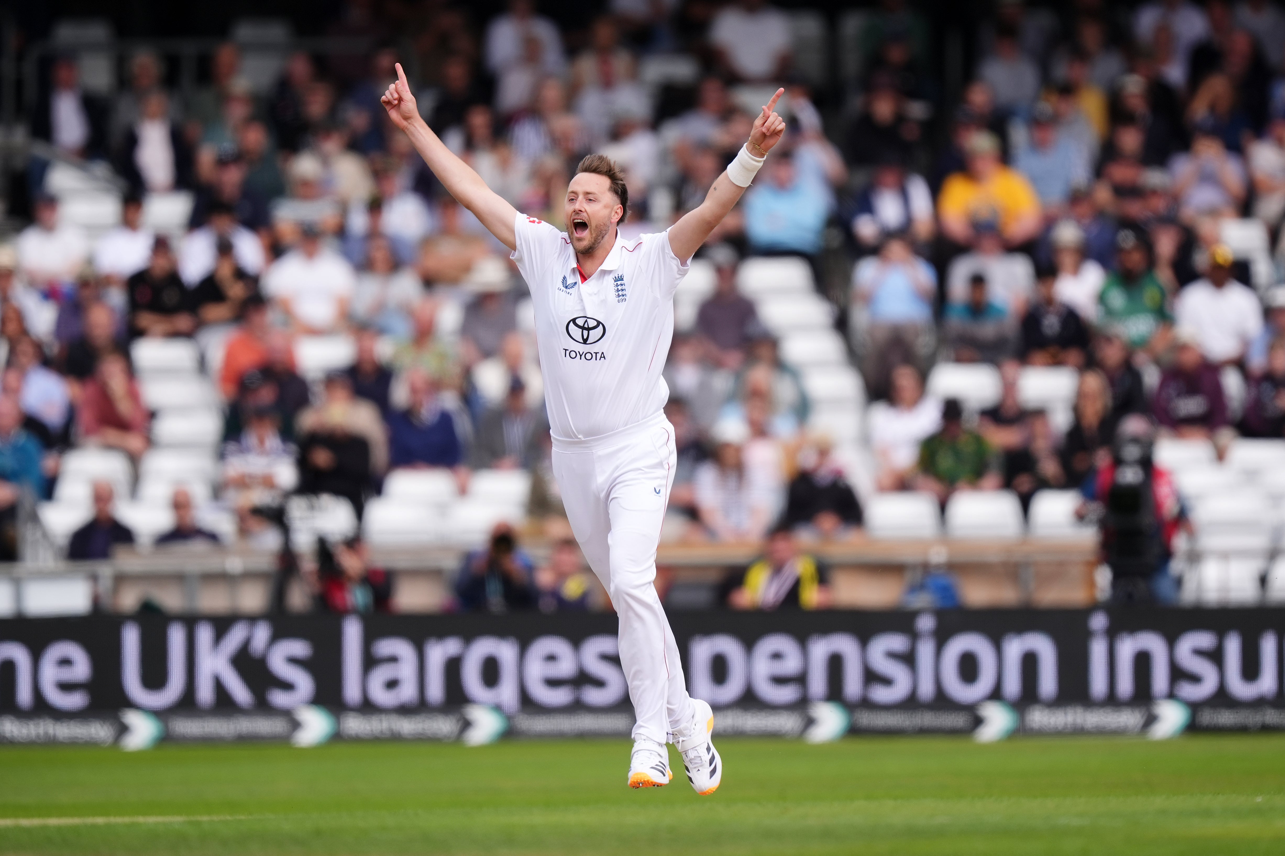 Ollie Robinson celebrates trapping Azan Awais lbw with the first ball of the match (Mike Egerton/PA)