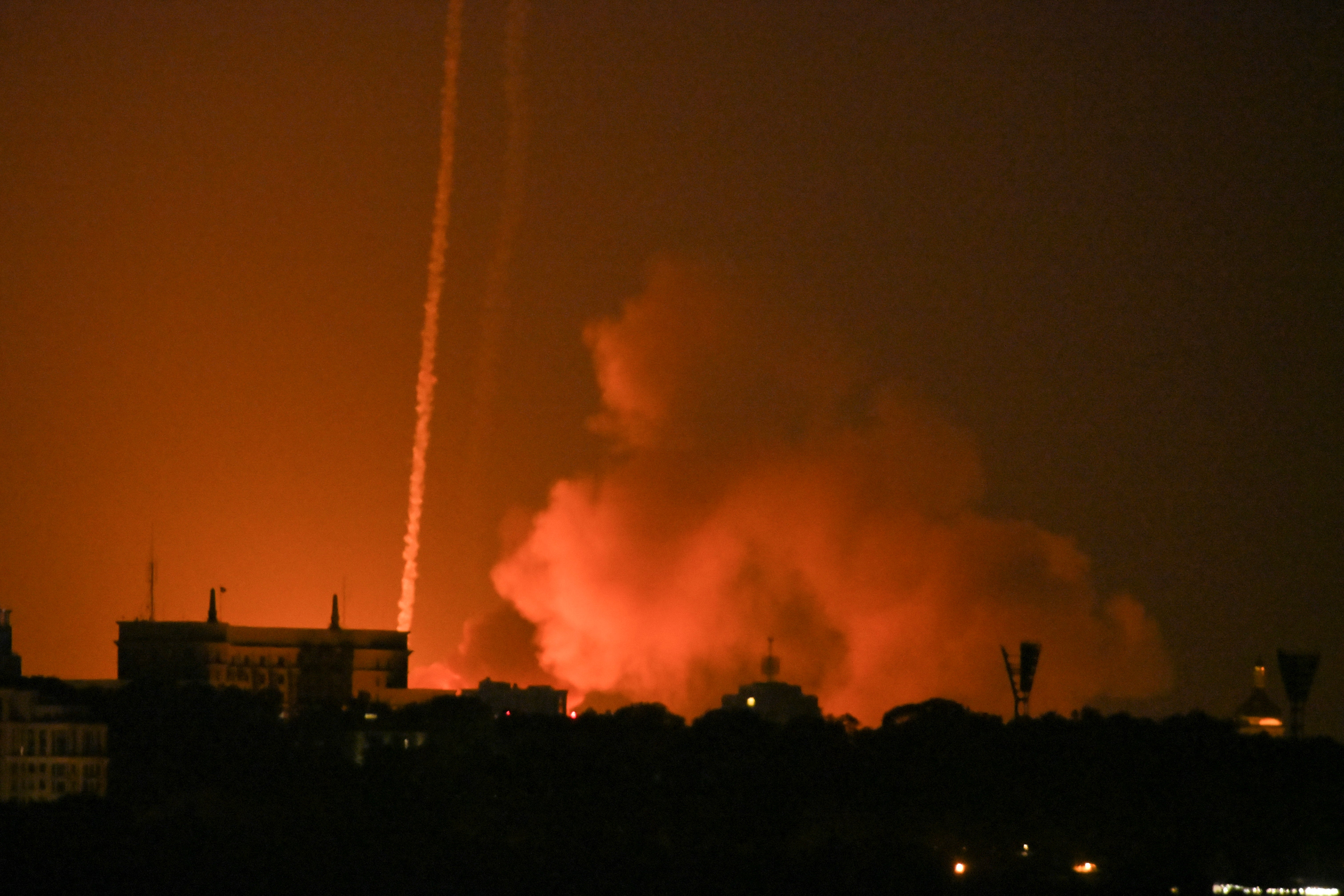 Trails of smoke seen as missiles hit Kyiv region in early morning attack