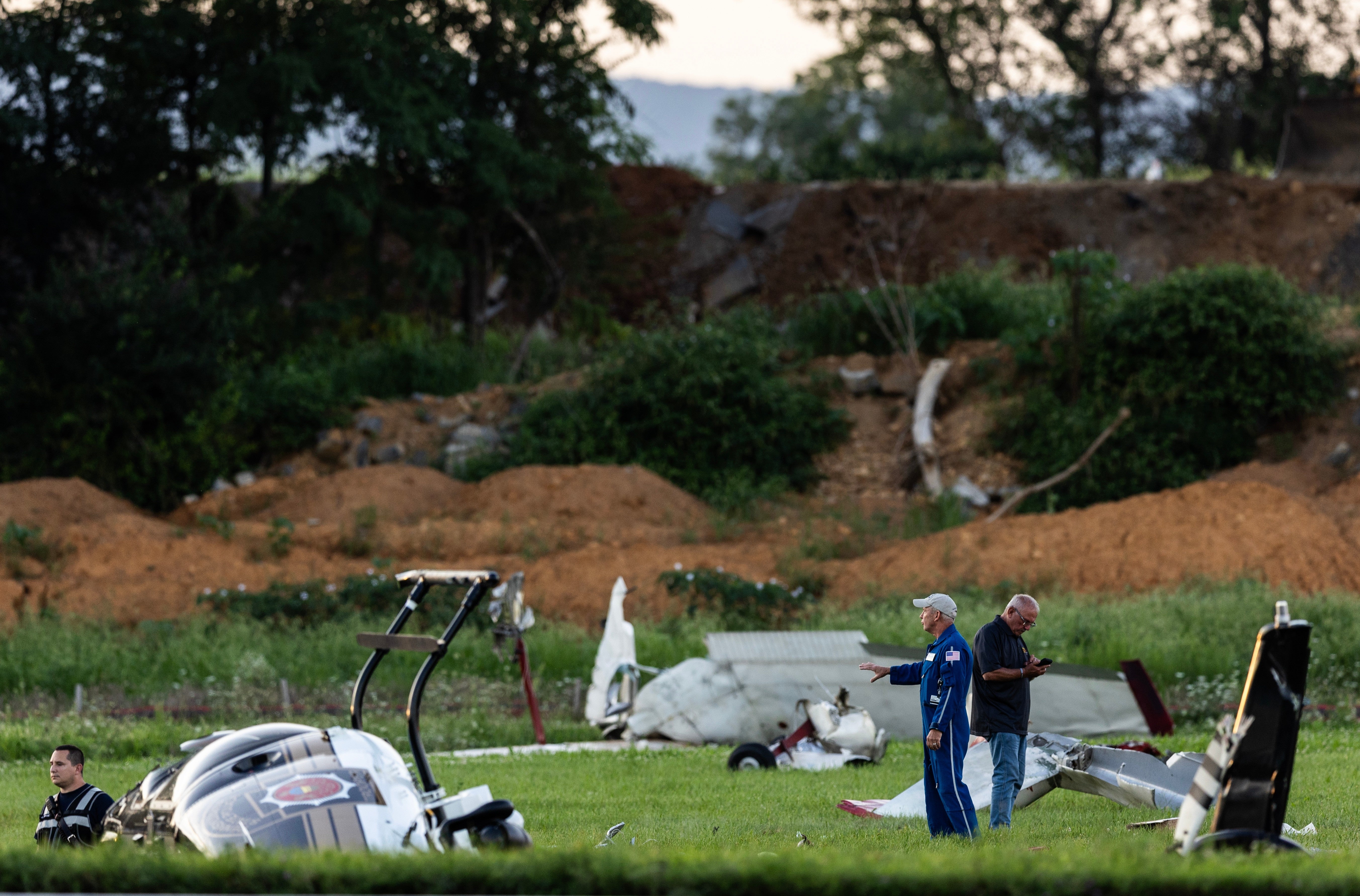 Authorities investigate a crash involving a Pennsylvania State Police helicopter and a small plane at the Carlisle airport