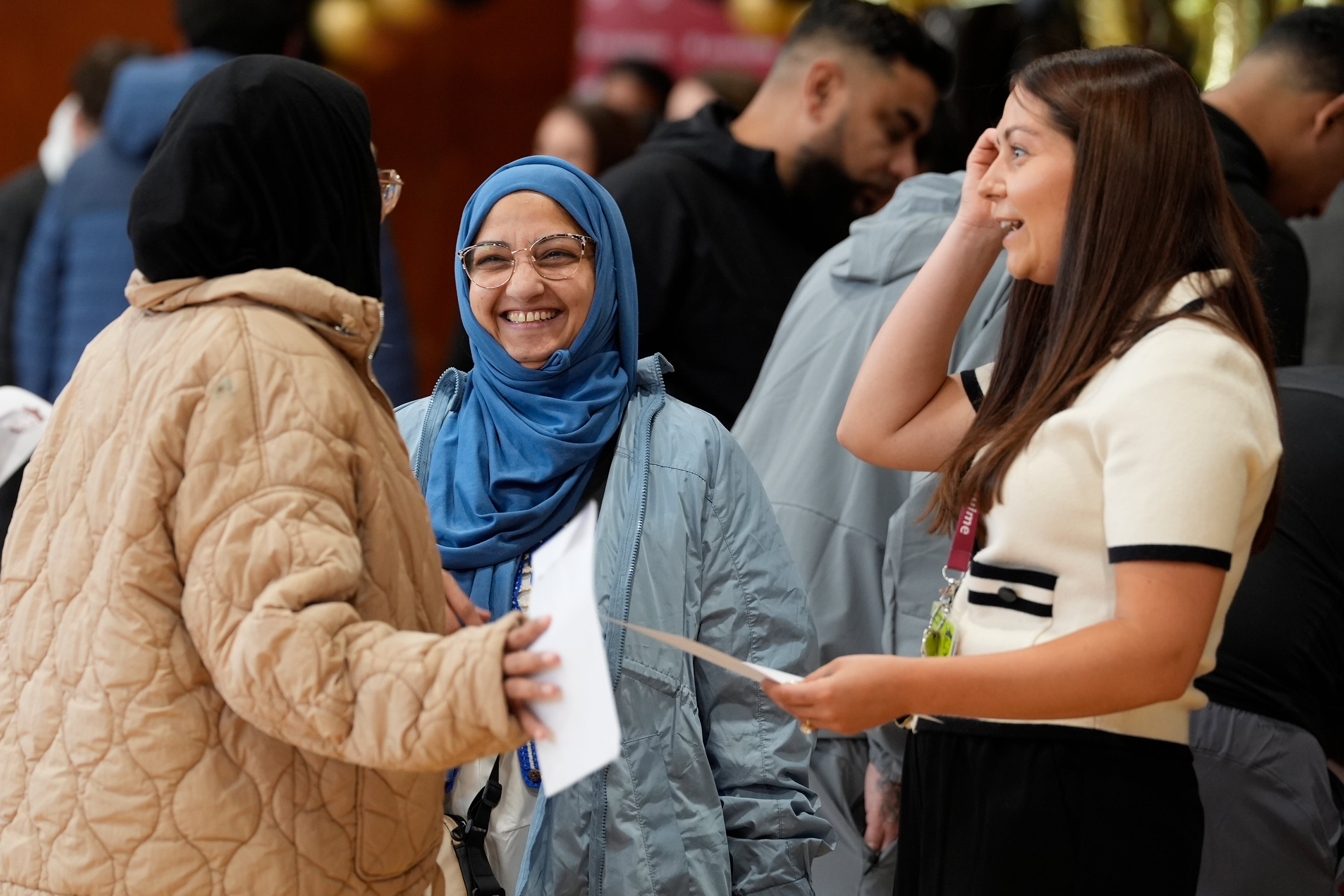 Pupils collect their GCSE results at Harper Green School in Farnworth, Bolton (PA)